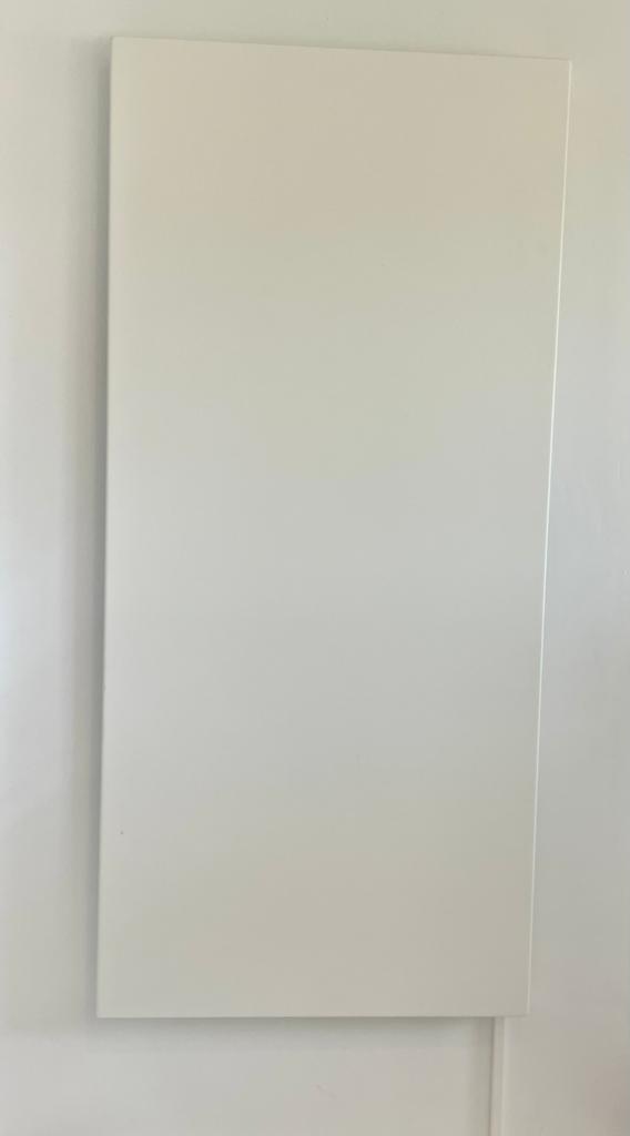 White rectangular panel on a white wall.