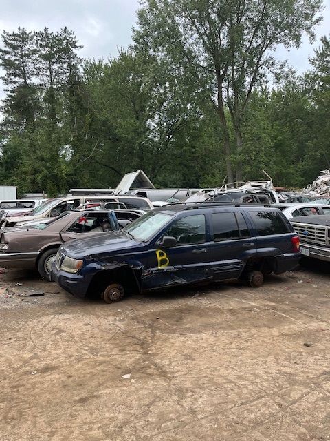 A lot of cars are parked in a lot.