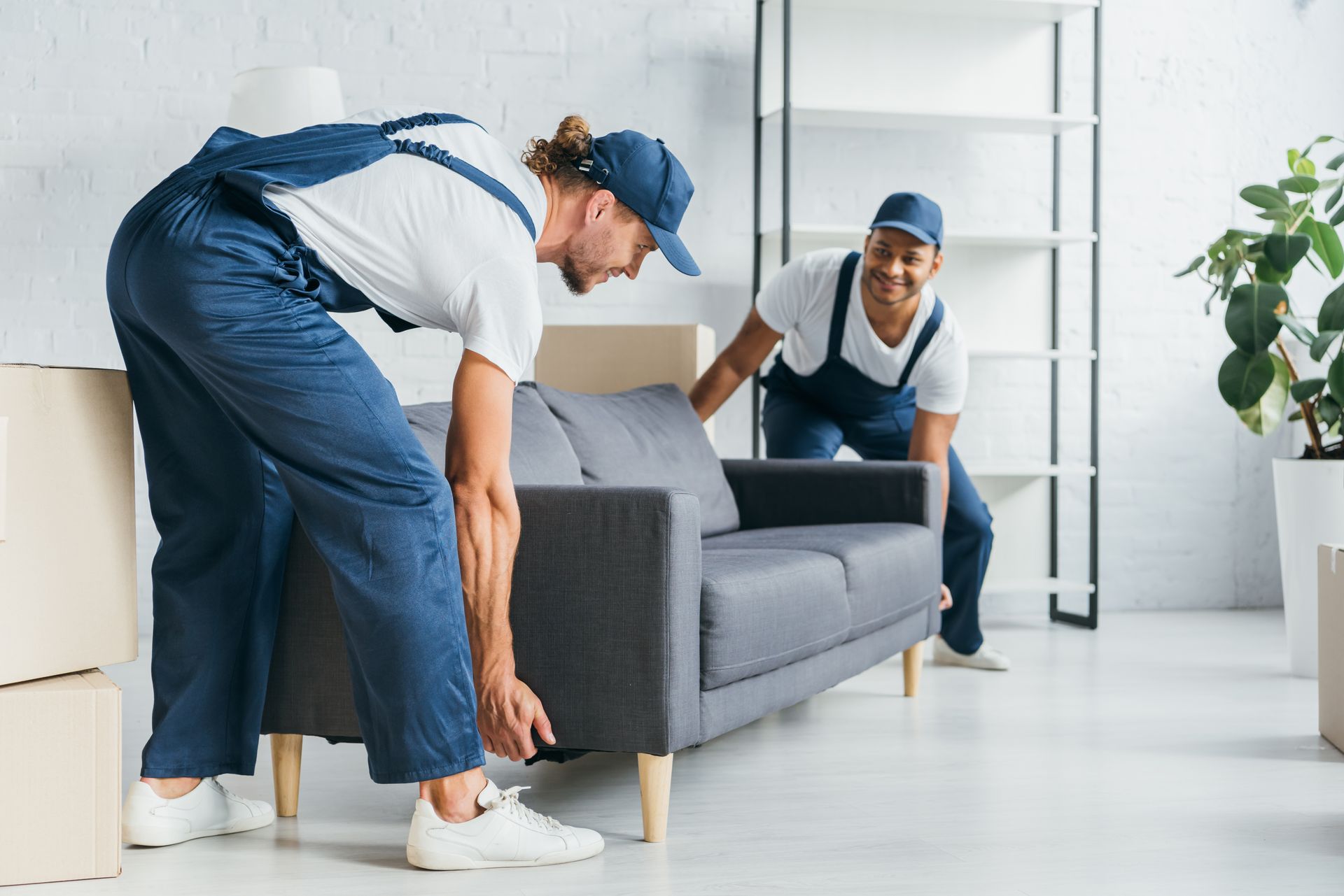 Movers loading boxes into a moving truck.