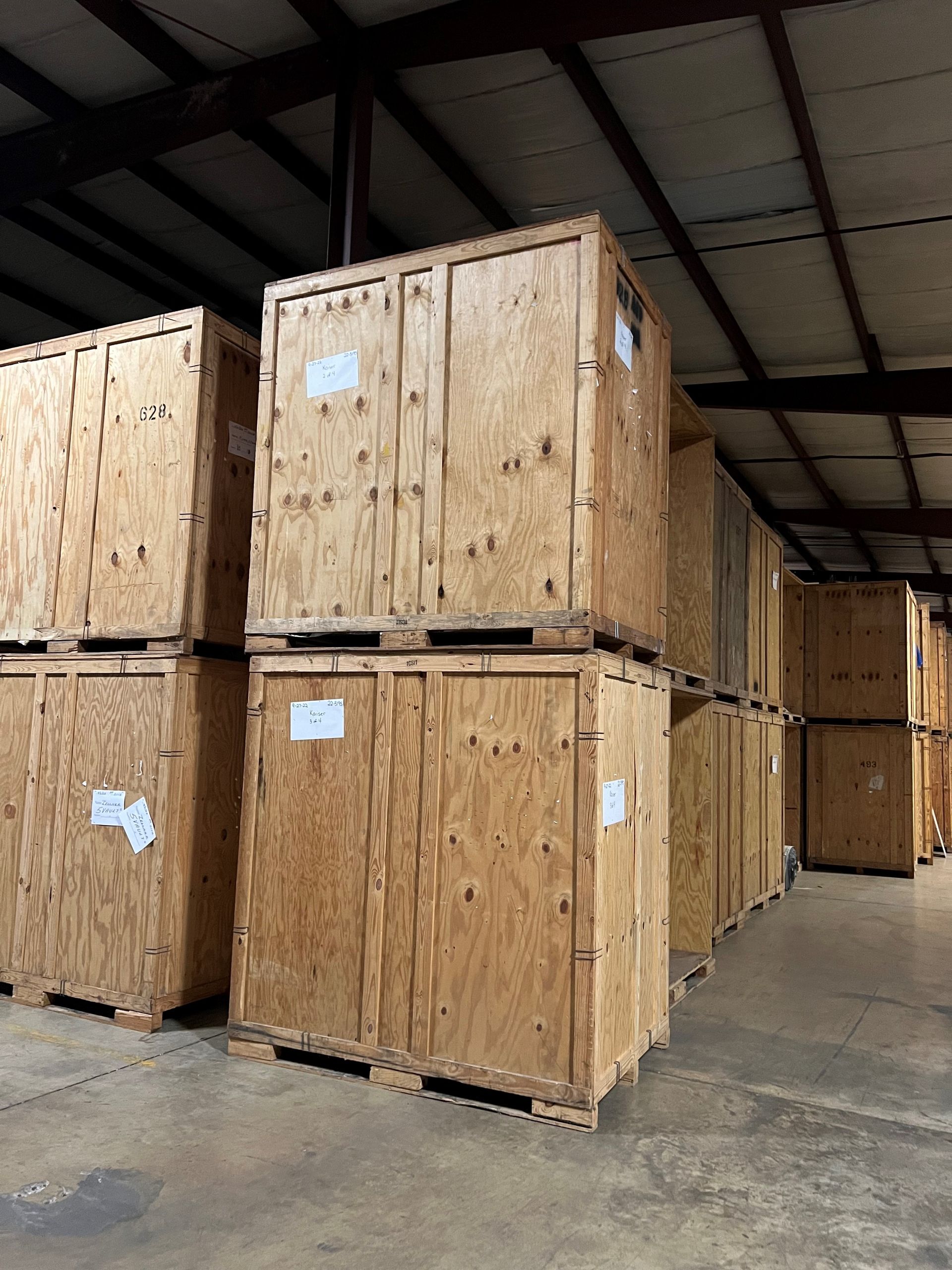 Wooden crates stacked in a warehouse.