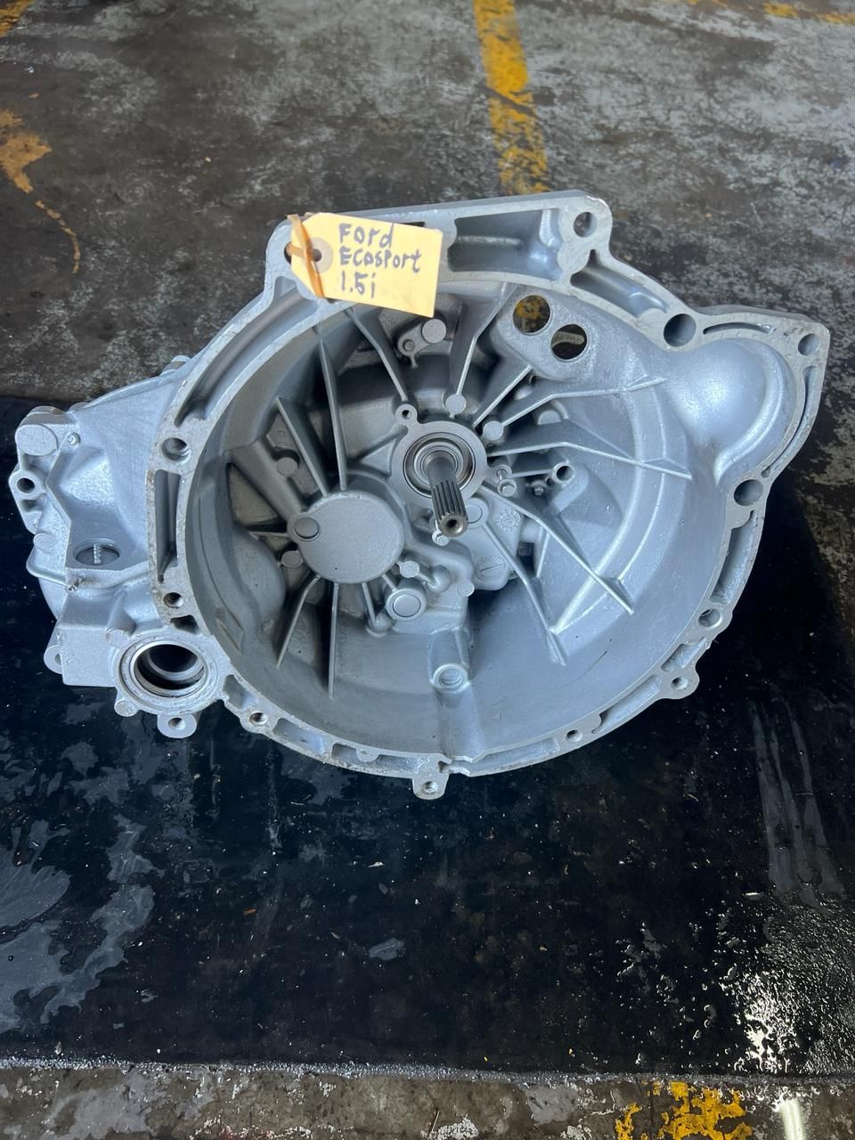 A close-up view of a high-performance 10R80 transmission displayed in a showroom, showcasing its advanced engineering and design.