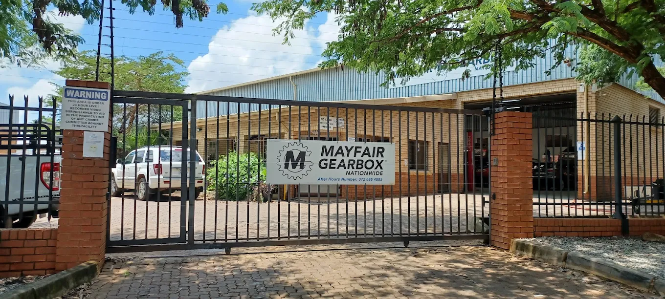 Mayfair Gearbox workshop entrance with front gate and business sign.