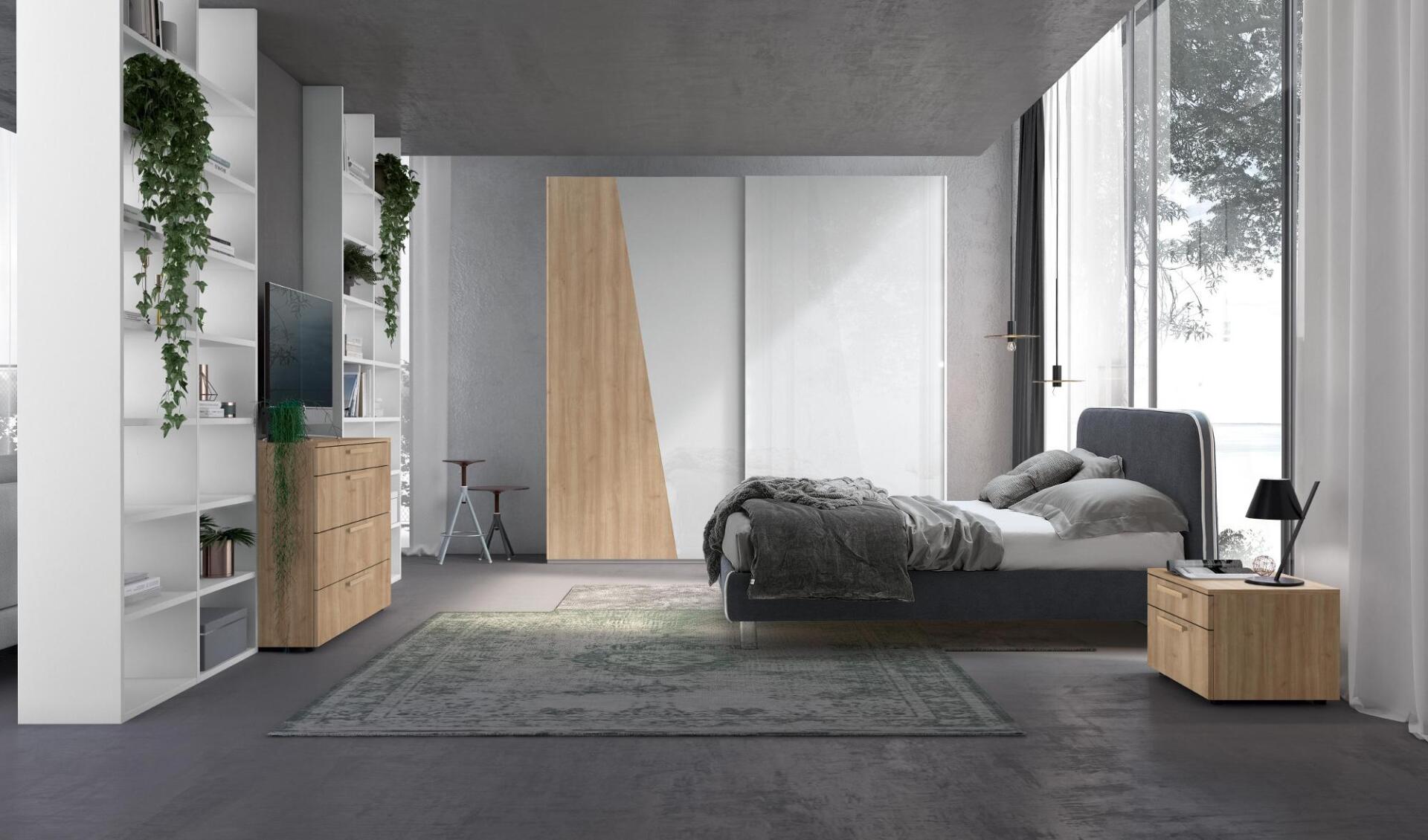 Camera da letto moderna con letto, armadio, scaffali e tappeto. Pavimento in cemento, pareti bianche e una grande finestra.