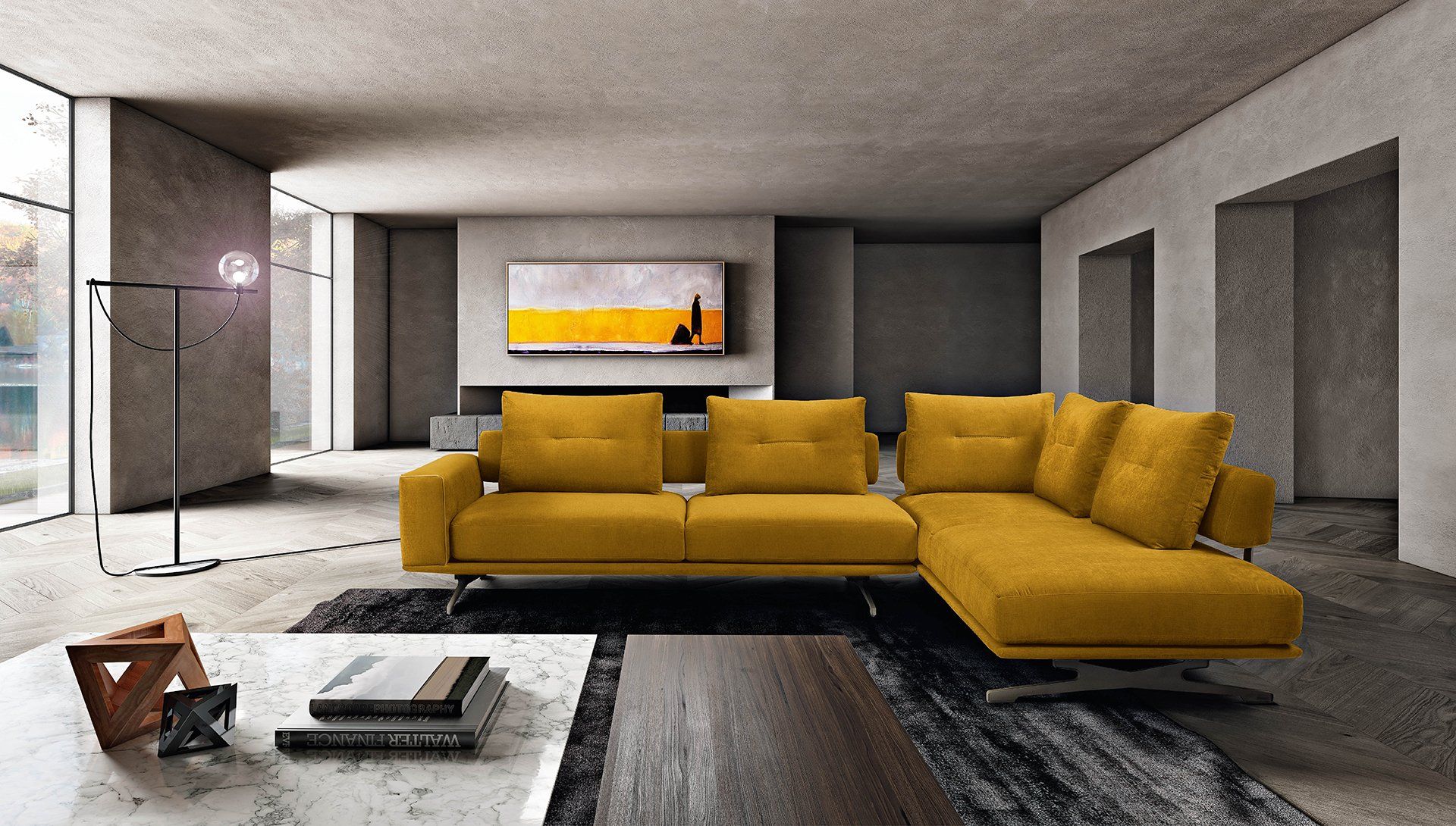 Divano componibile giallo in un soggiorno moderno con opere d'arte astratte, ampie finestre e pareti neutre.