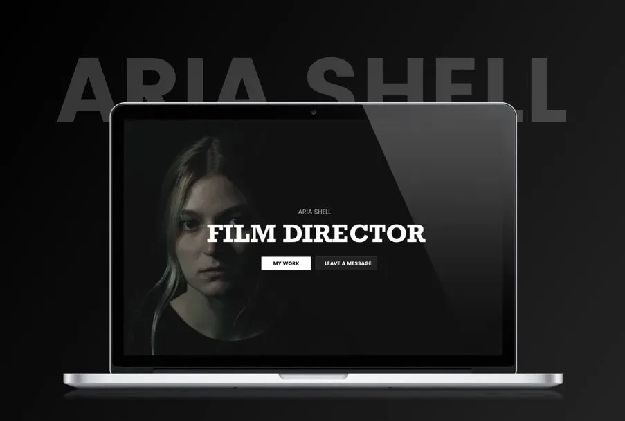 Laptop displaying a website for Aria Shell, a film director. Black and white color scheme.