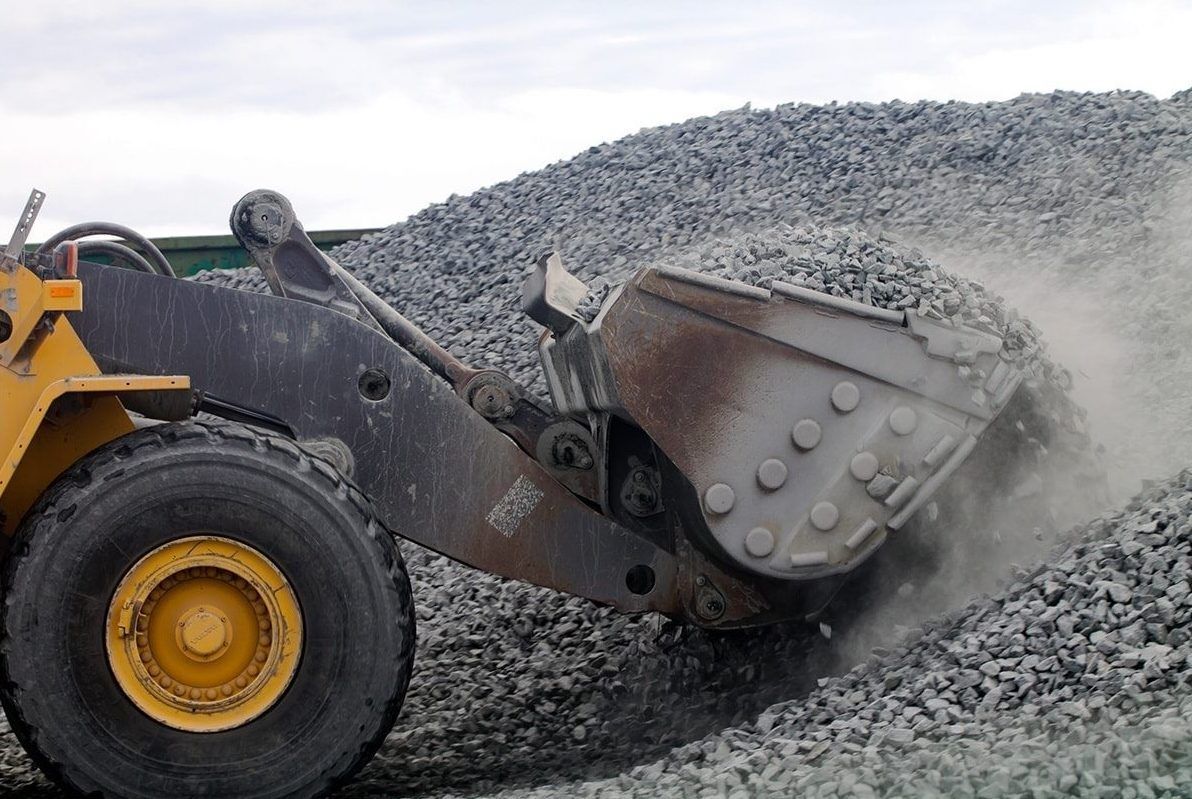 Excavator Scooping Gravel — Quarry Products In Moranbah, QLD