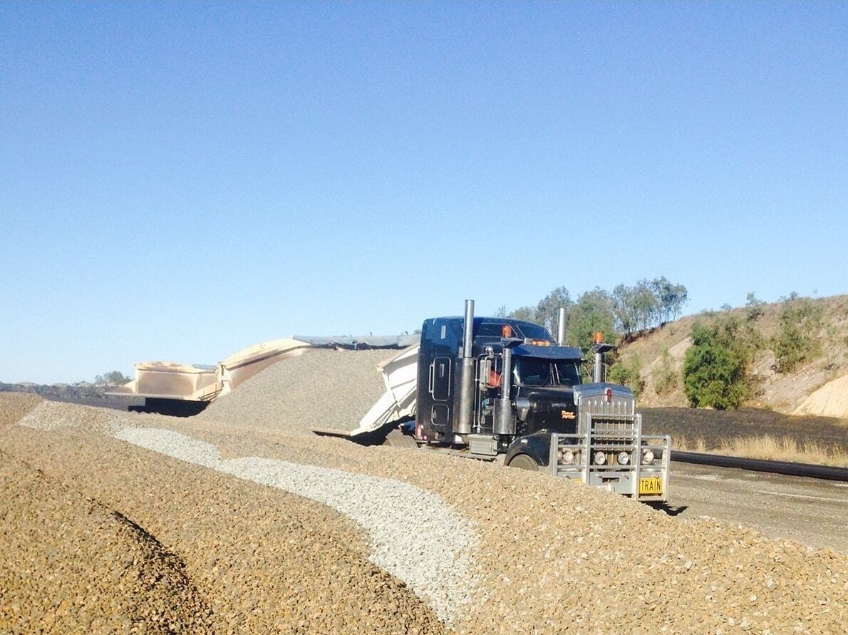 Truck Tipping Rocks — Quarry Products In Moranbah, QLD