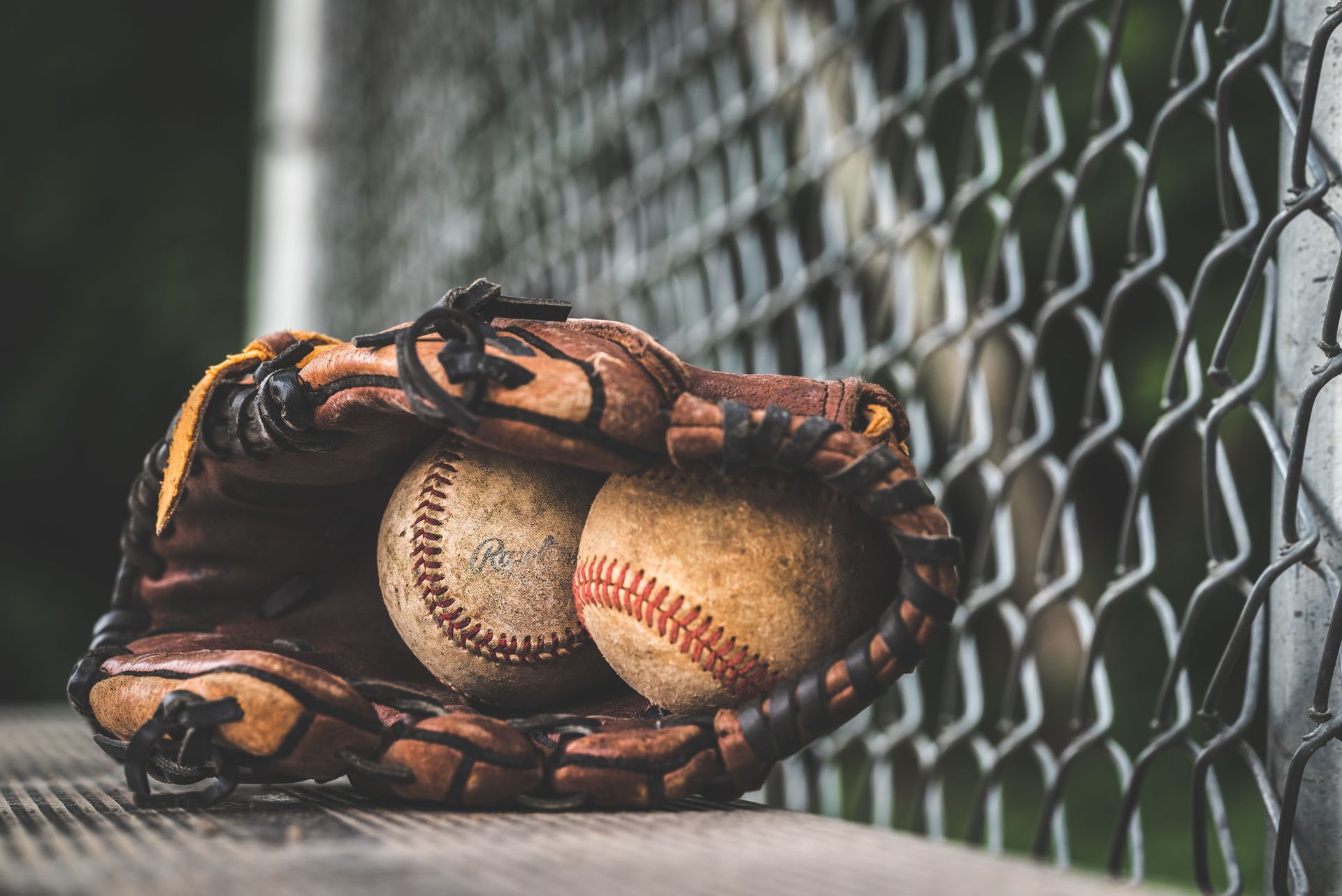 Baseball glove and ball, representing game day car service to Busch Stadium and Cardinals games