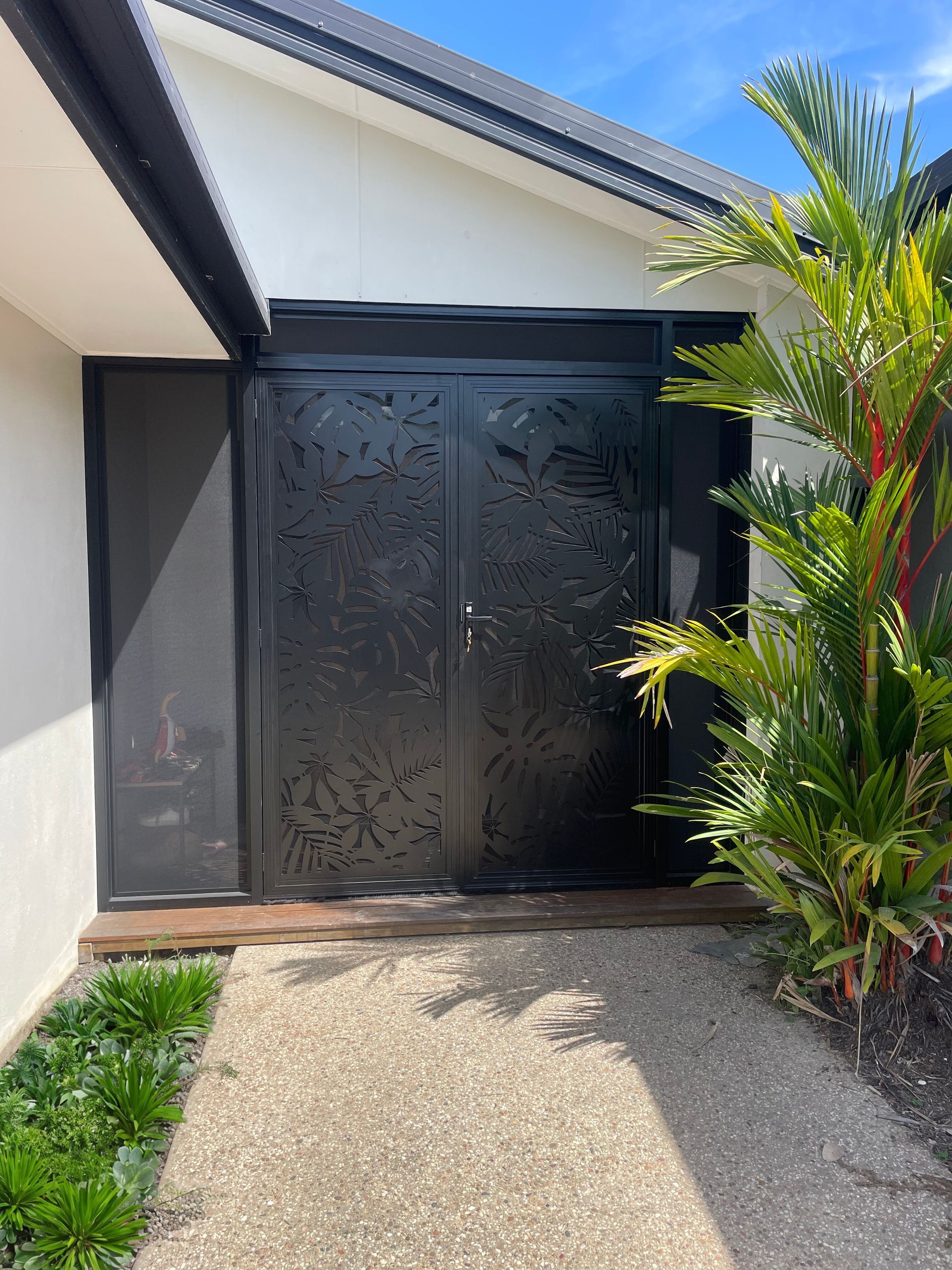 Black Patterned Metal Double Doors on a Home's Entrance — A1 Security Screens Cairns In Smithfield, QLD