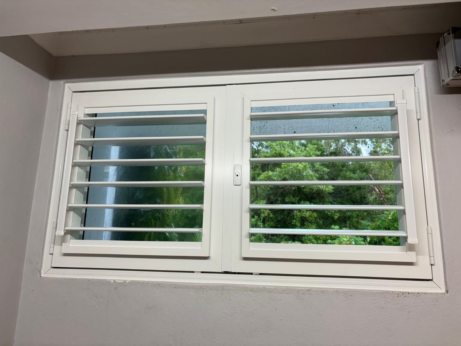 White-framed Window With Adjustable Horizontal Slats — A1 Security Screens Cairns In Smithfield, QLD