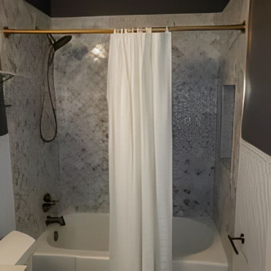 Small bathroom with a bathtub, shower curtain, and tiled walls.