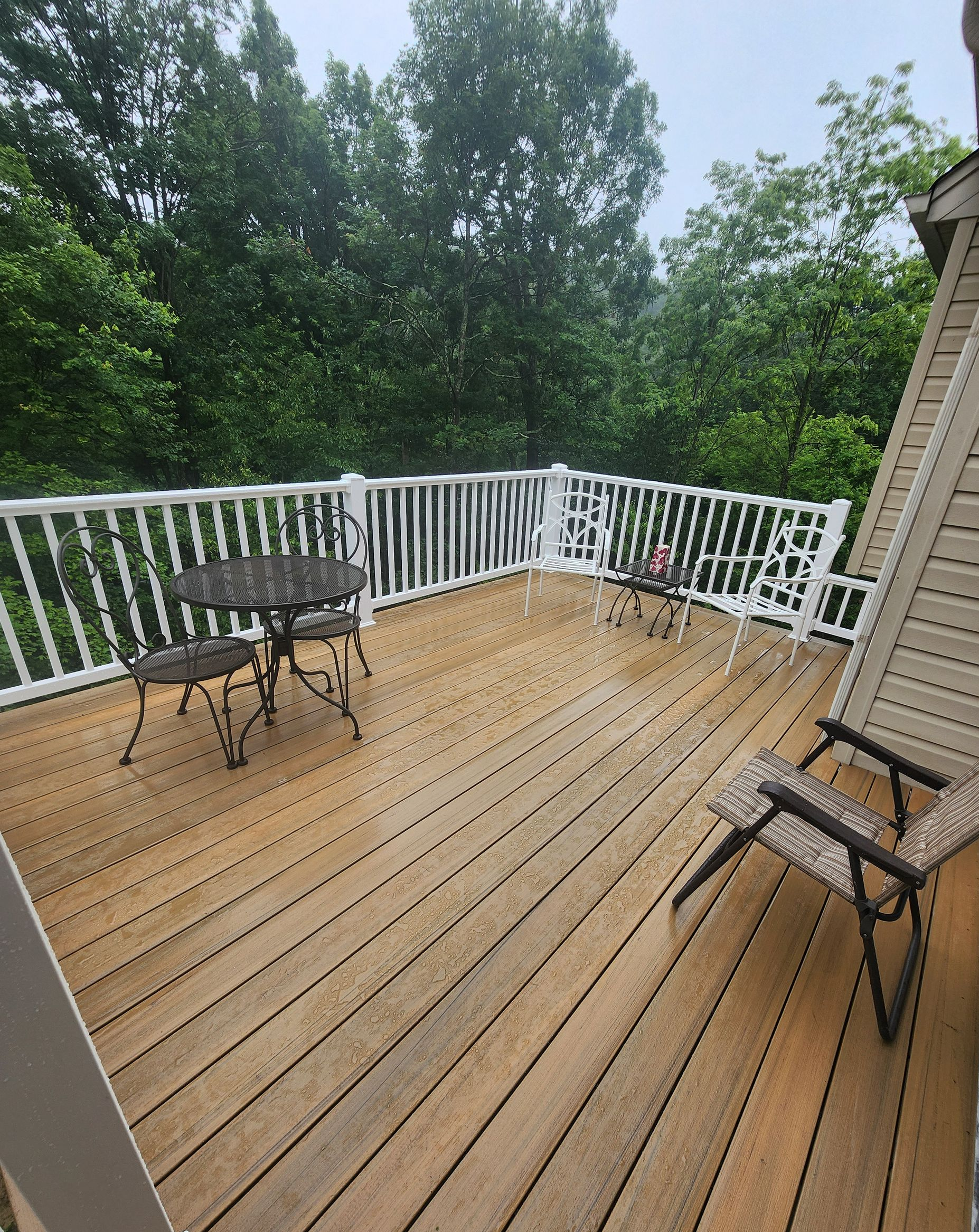 A wooden deck with stairs leading up to it