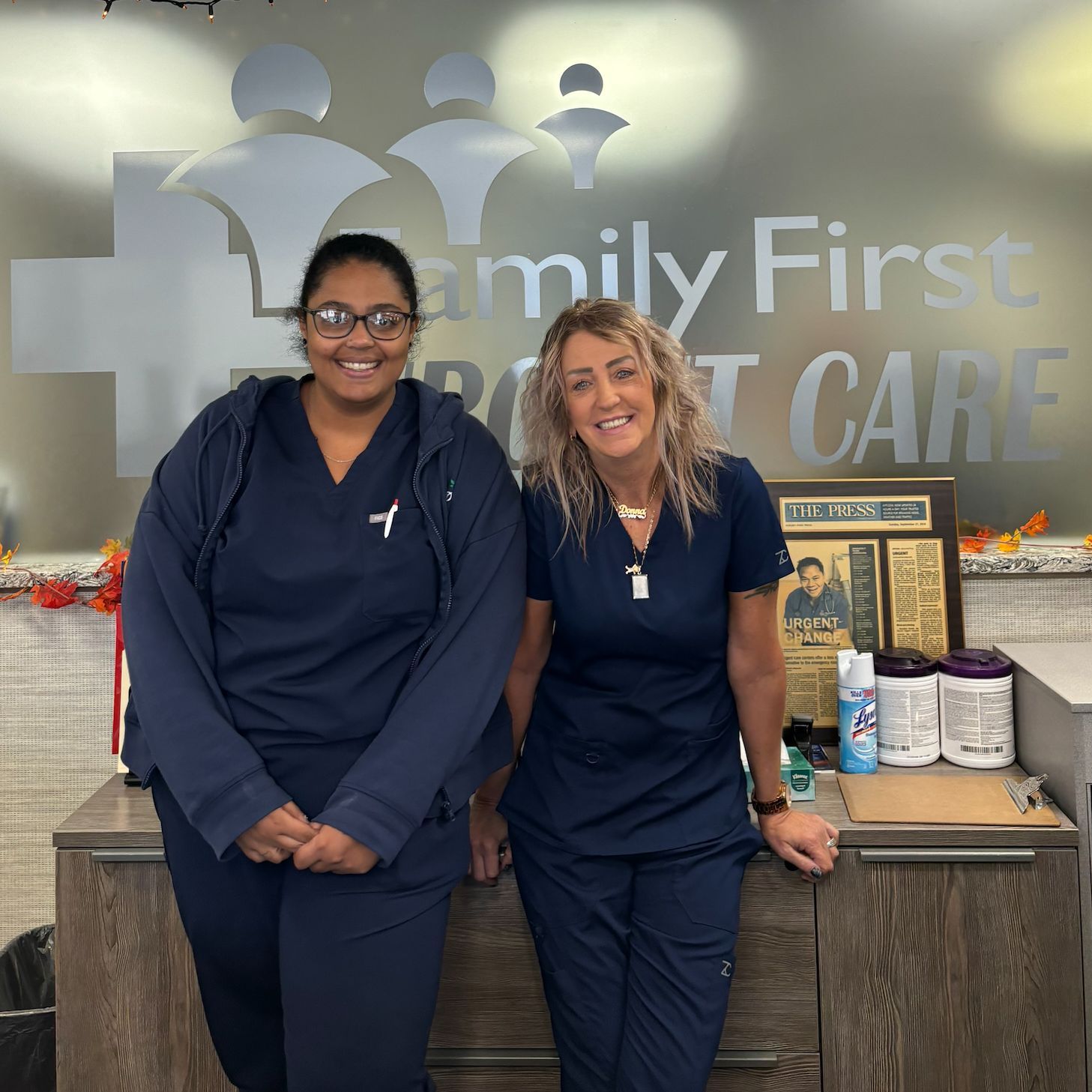 Two women in blue scrubs at 