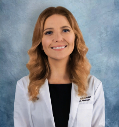 Woman in white coat, smiling, against blue background. Medical professional.