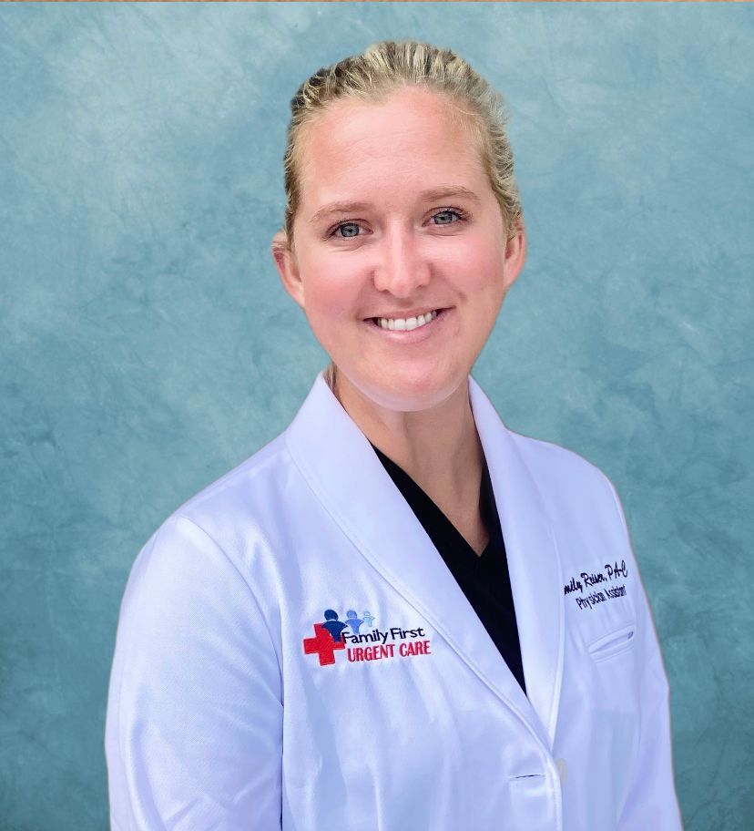 Woman in white coat smiles, “Family First Urgent Care” logo on chest.