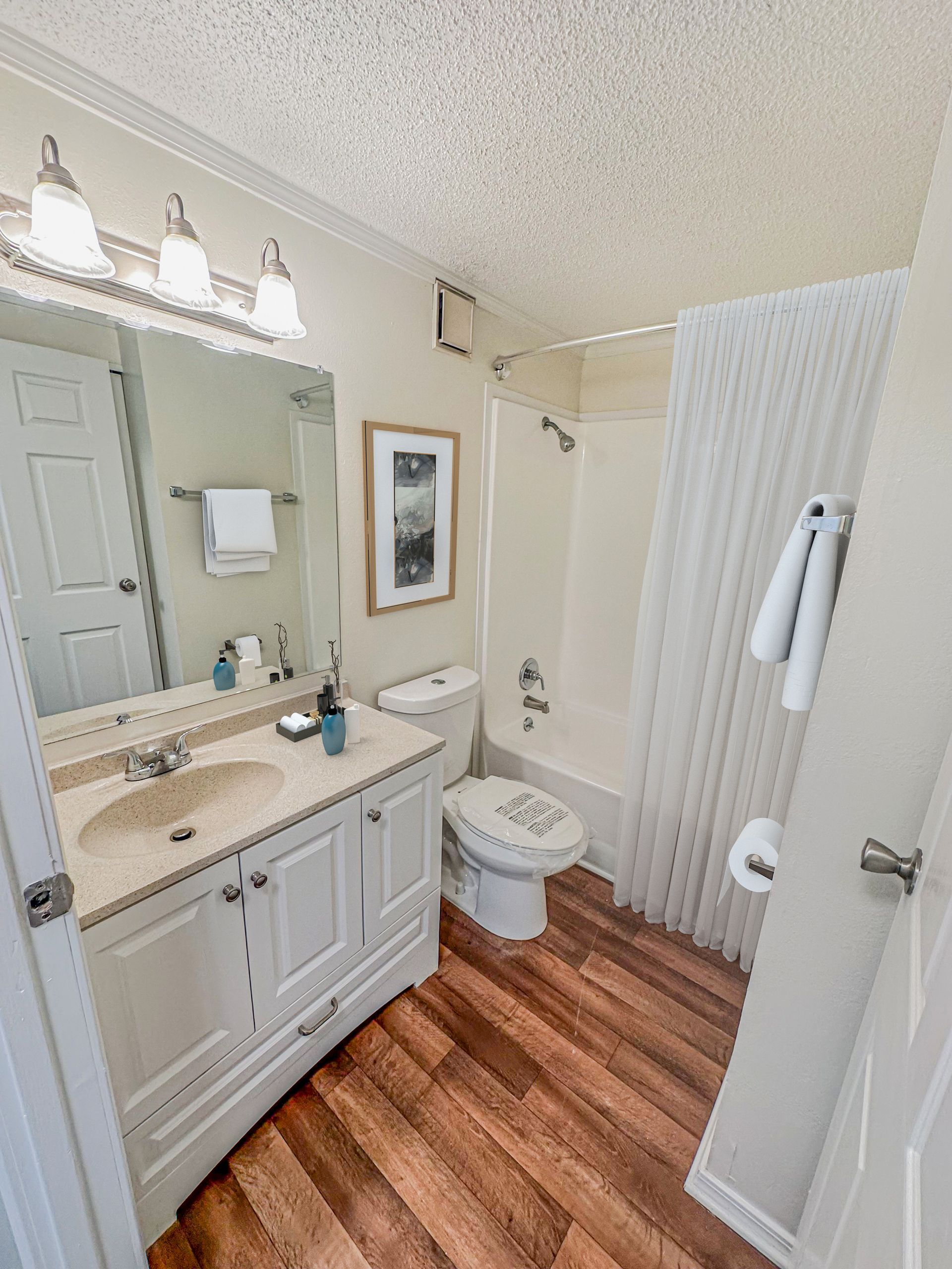 Photo of a bathroom with a shower/tub combo