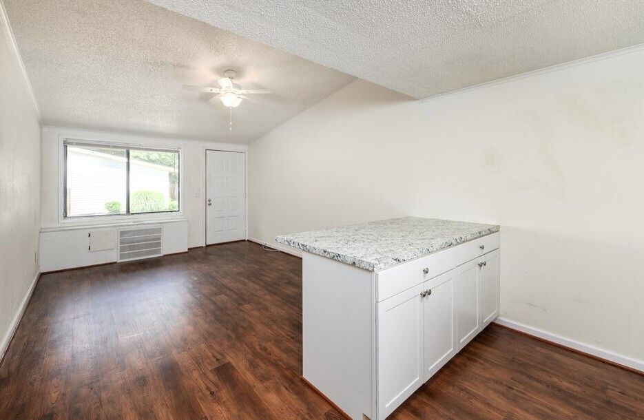 Photo of a living room, seen from the kitchen