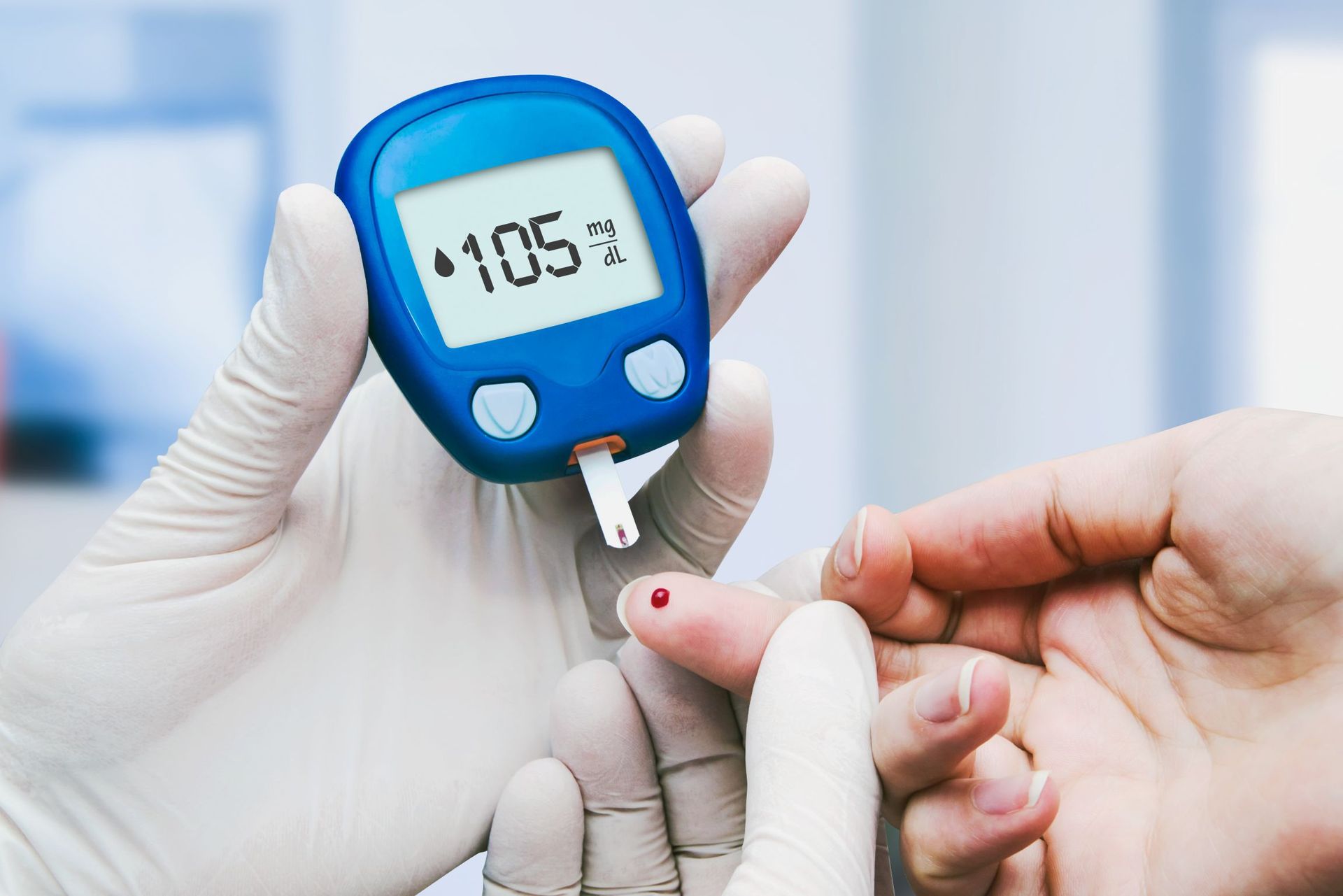 doctor making blood sugar test