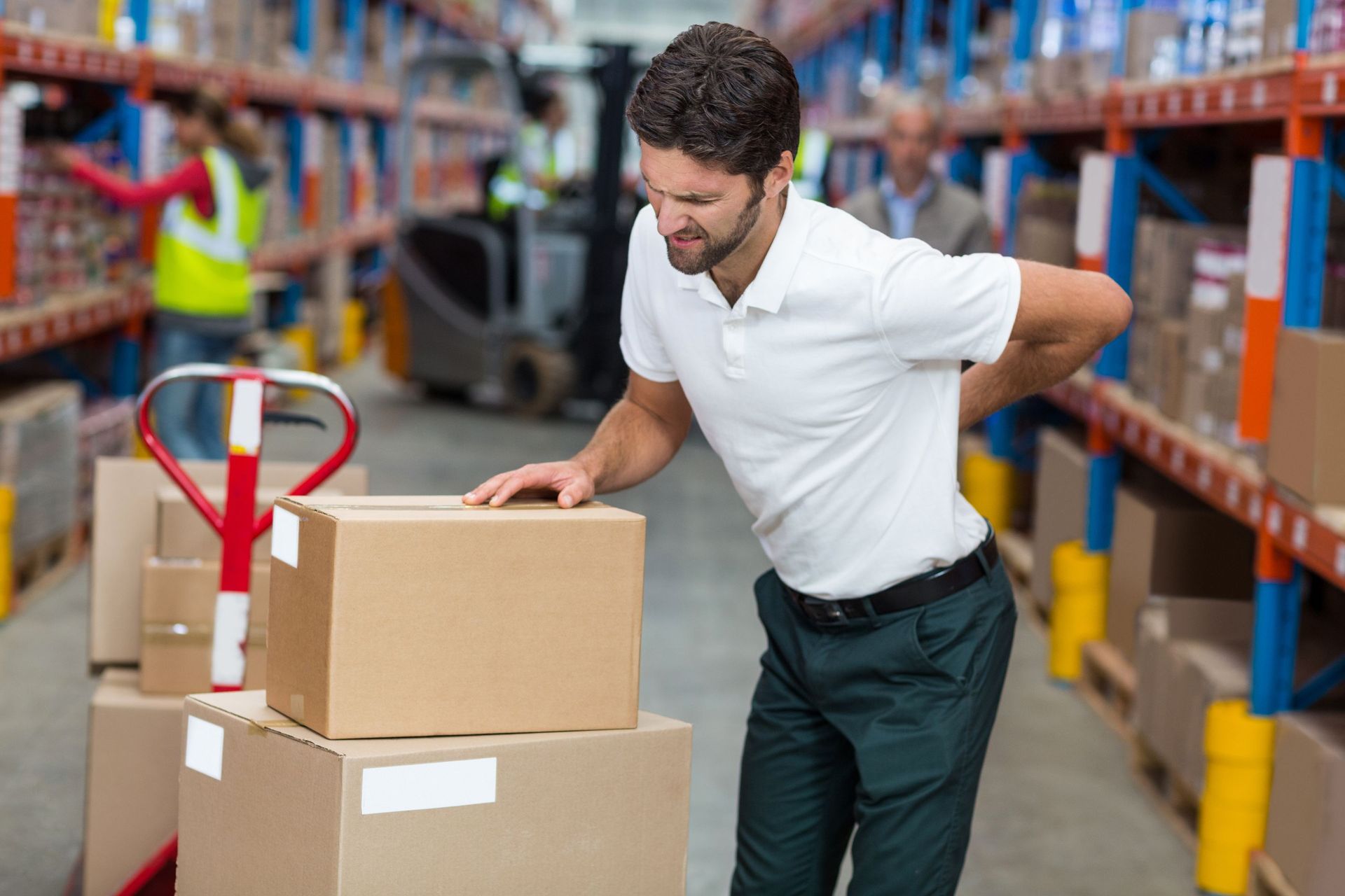focus worker having backache warehouse