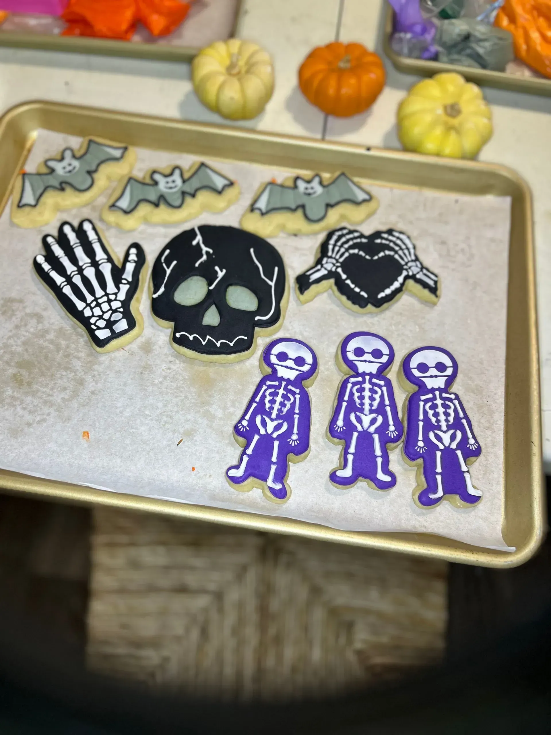 Halloween-themed tray with skeleton and bat stickers, colorful foam stars, and purple skeleton cutouts