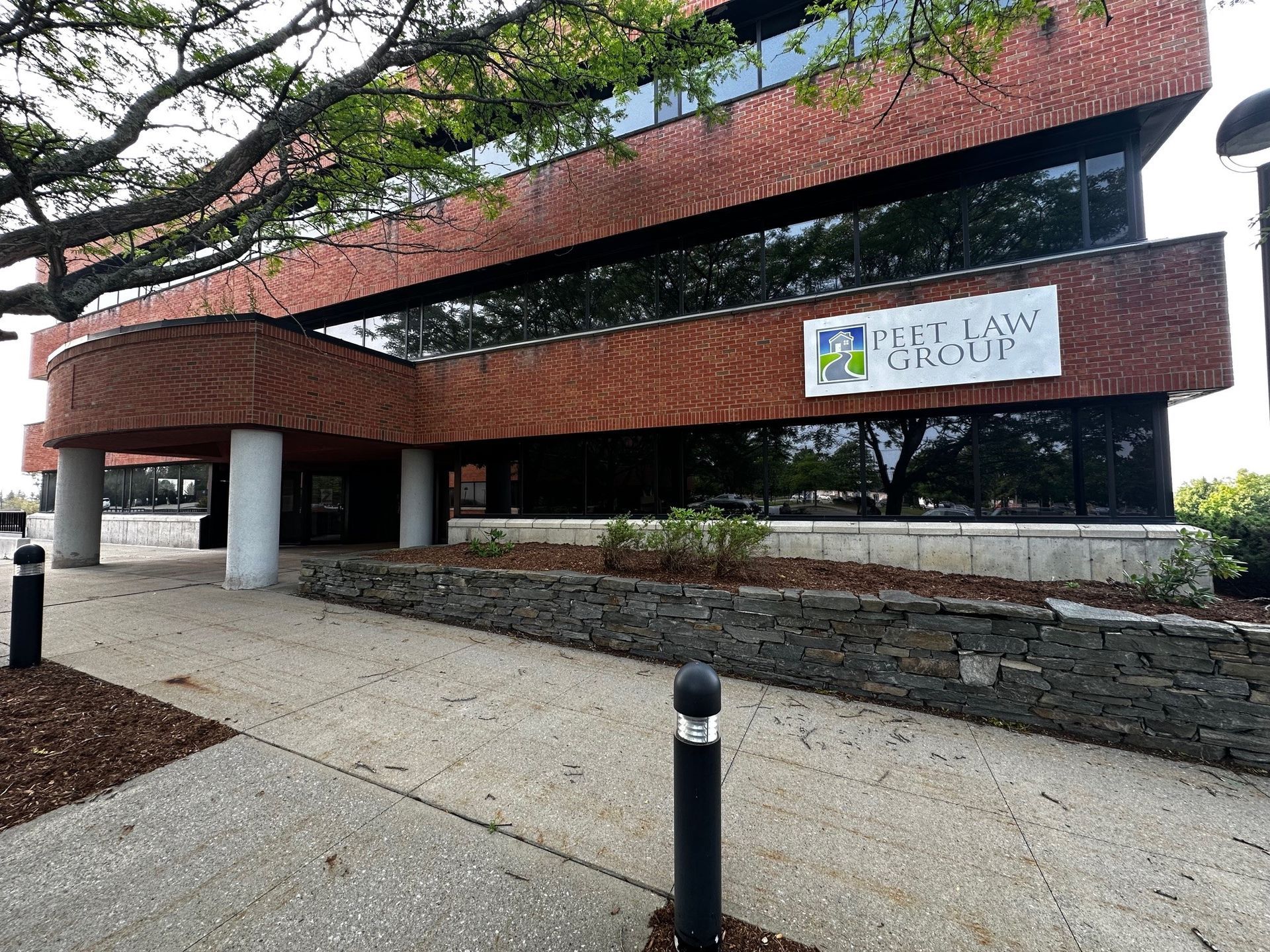 A large brick building with a sign on the side of it.