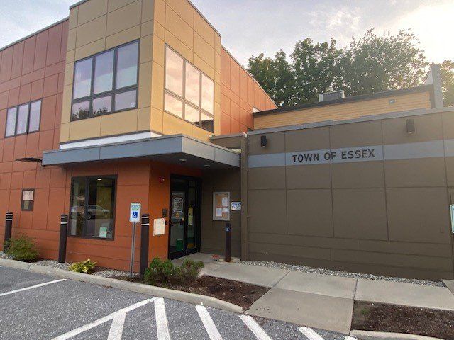 Essex Junction town building with a parking lot in front of it