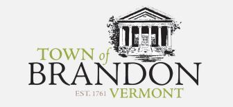 The town of brandon logo is a black and white image of a building.