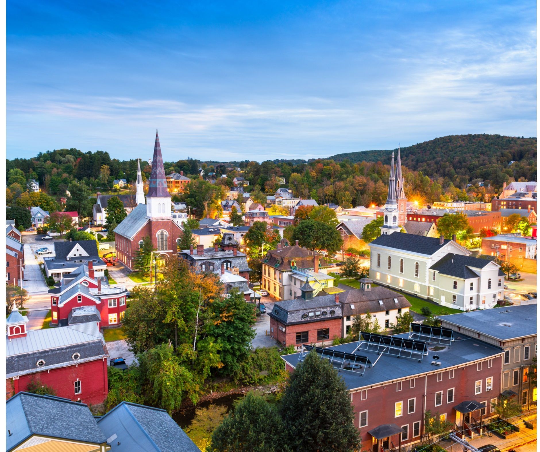 An aerial view of a small town with a lot of buildings and trees