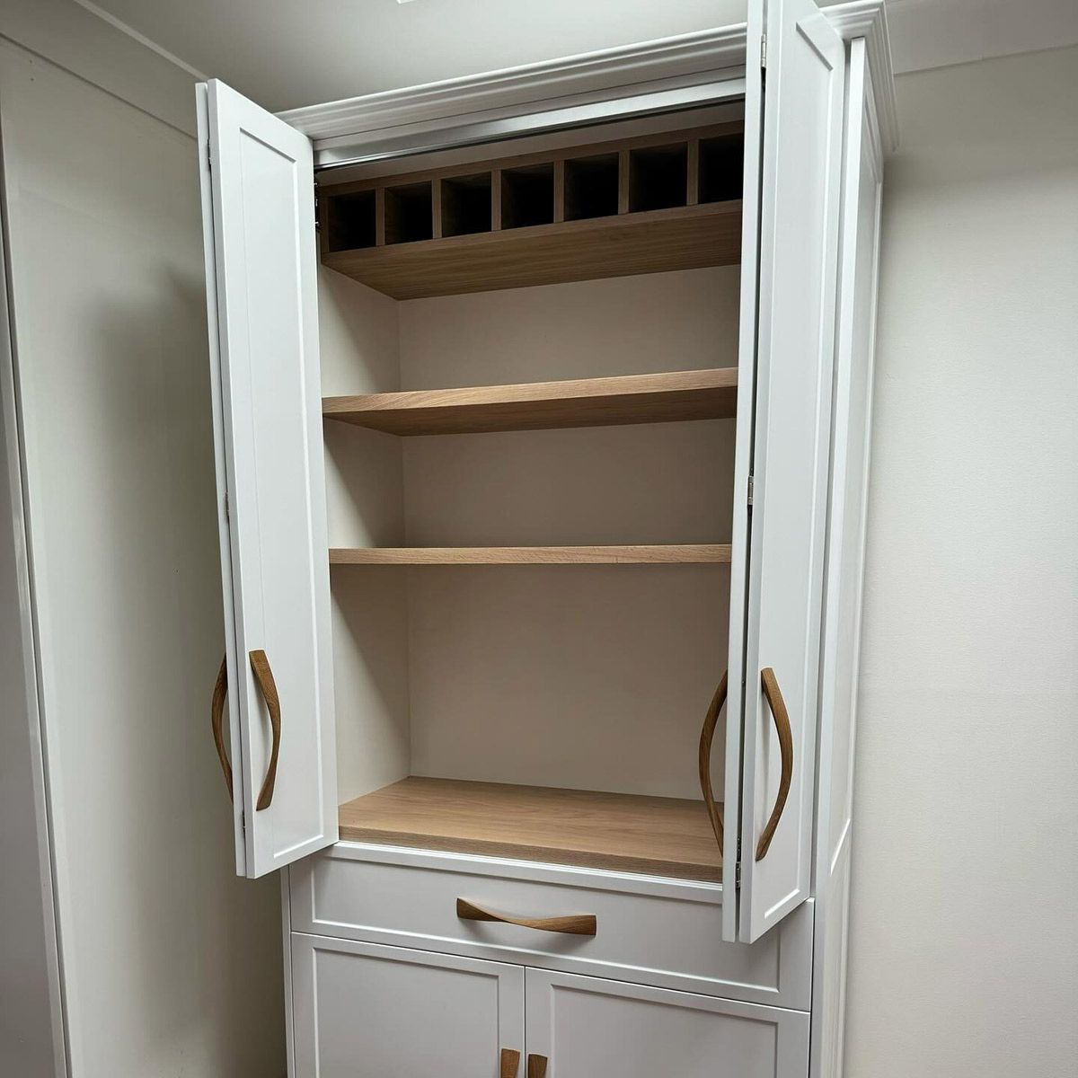 A White Cabinet With Wooden Shelves And Drawers With The Doors Open — Kreuzer Cabinets In East Wagga Wagga, NSW