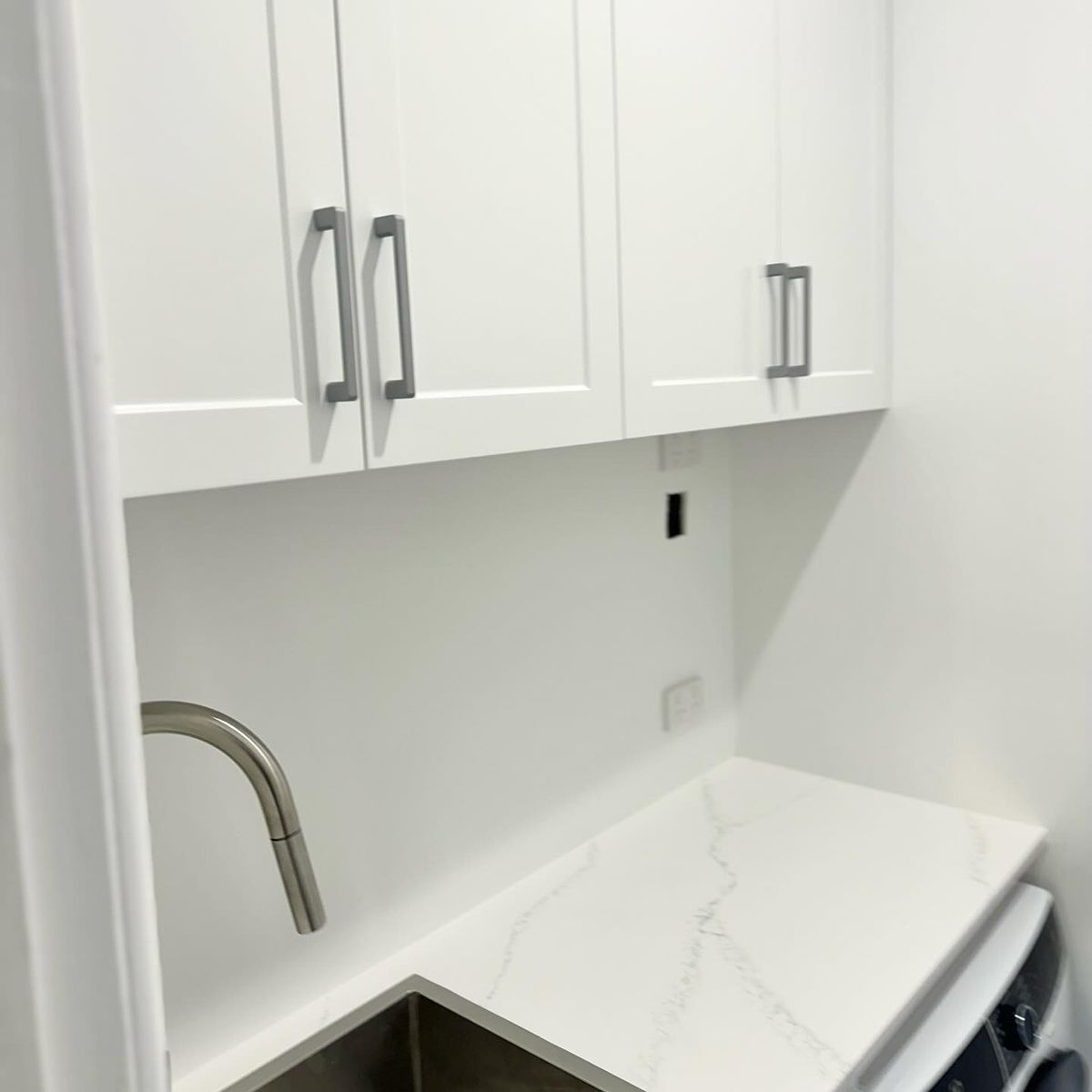 A Kitchen With White Cabinets And A Sink — Kreuzer Cabinets In East Wagga Wagga, NSW