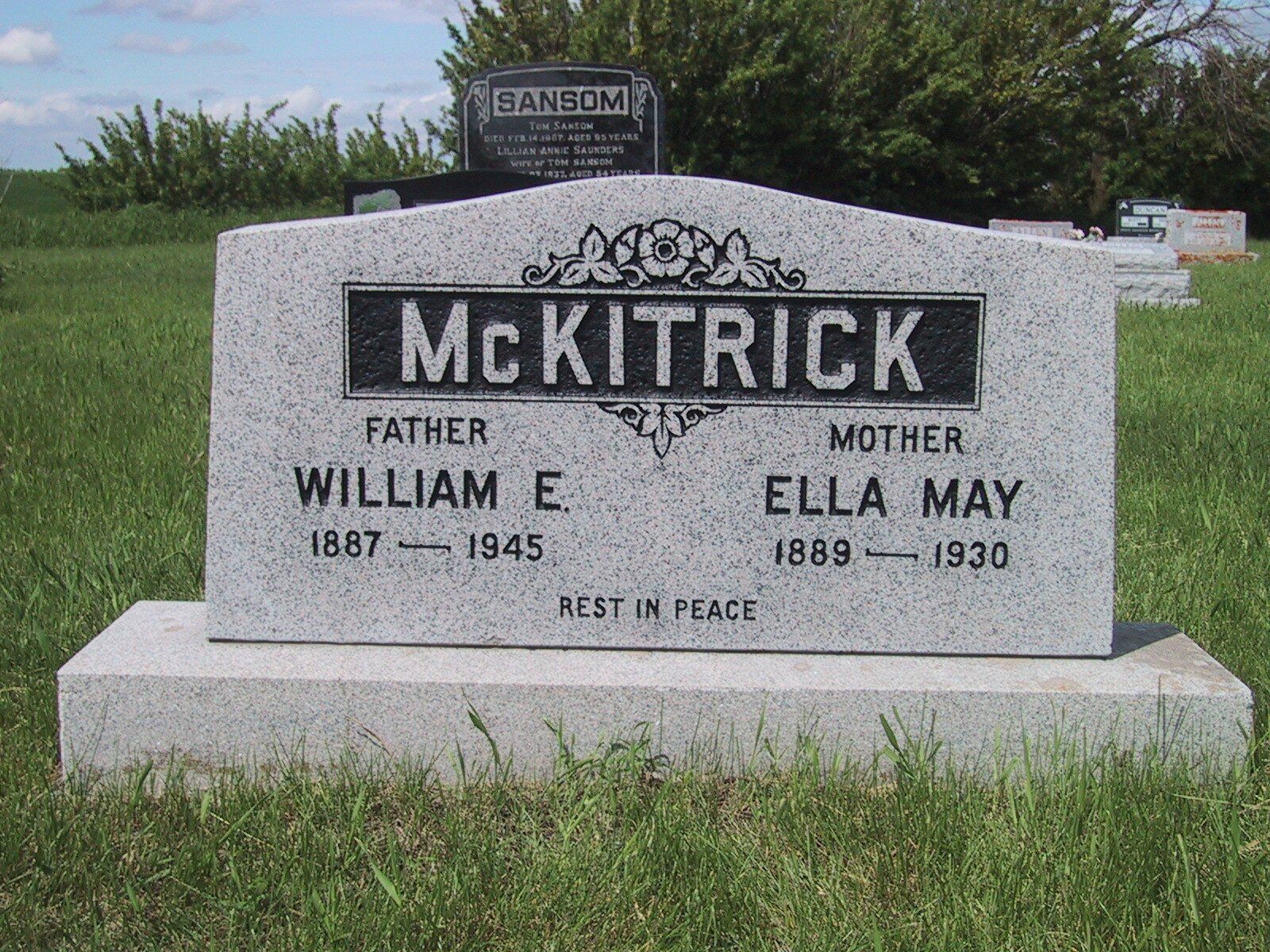 McKitrick gravestone for William E. and Ella May in a grassy cemetery