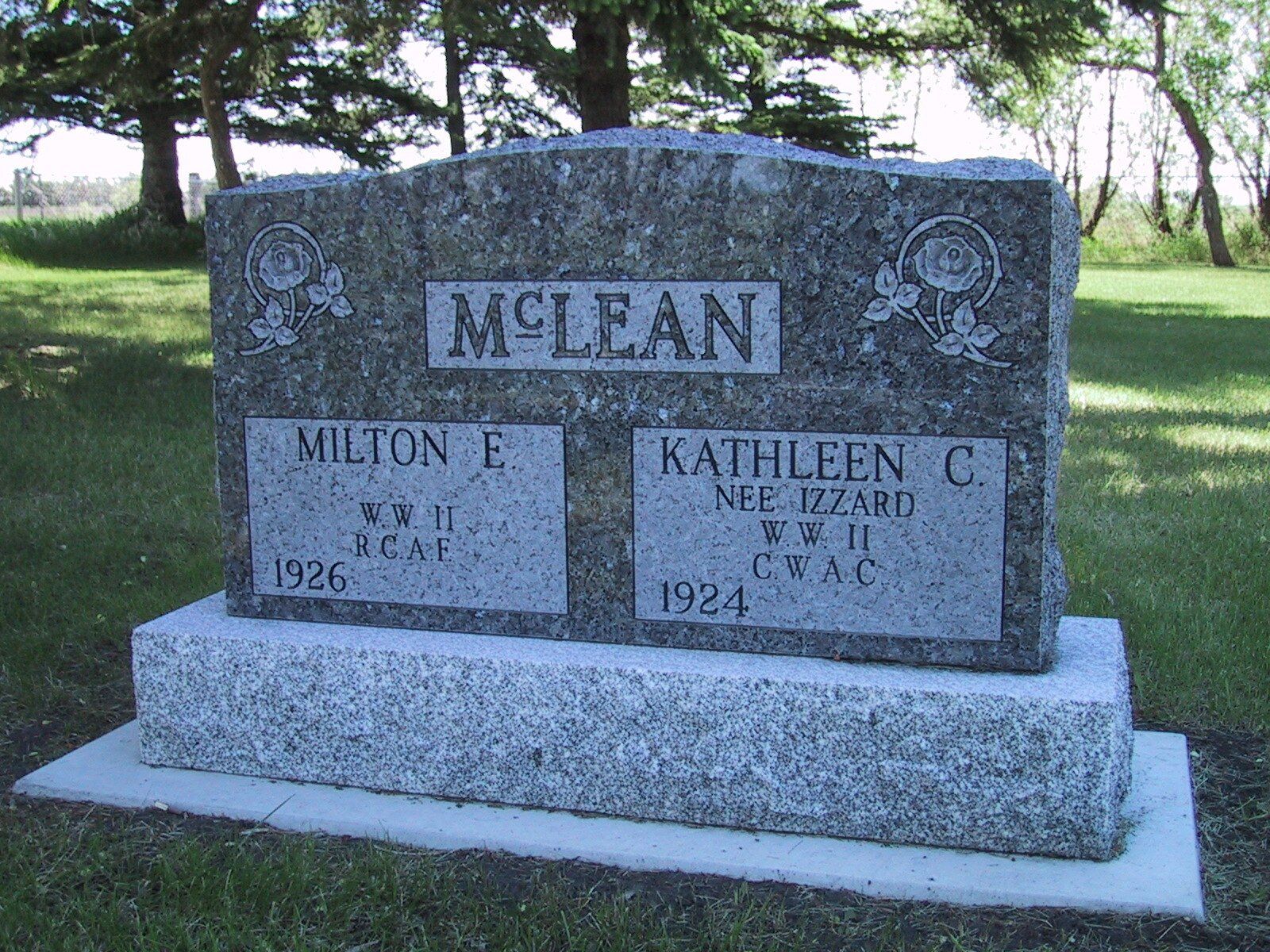 Granite family gravestone engraved “McLean” in a grassy cemetery setting
