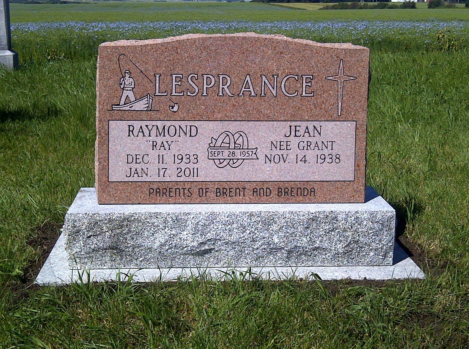 Brown gravestone in a grassy cemetery with the name LESPRANCE engraved on top.