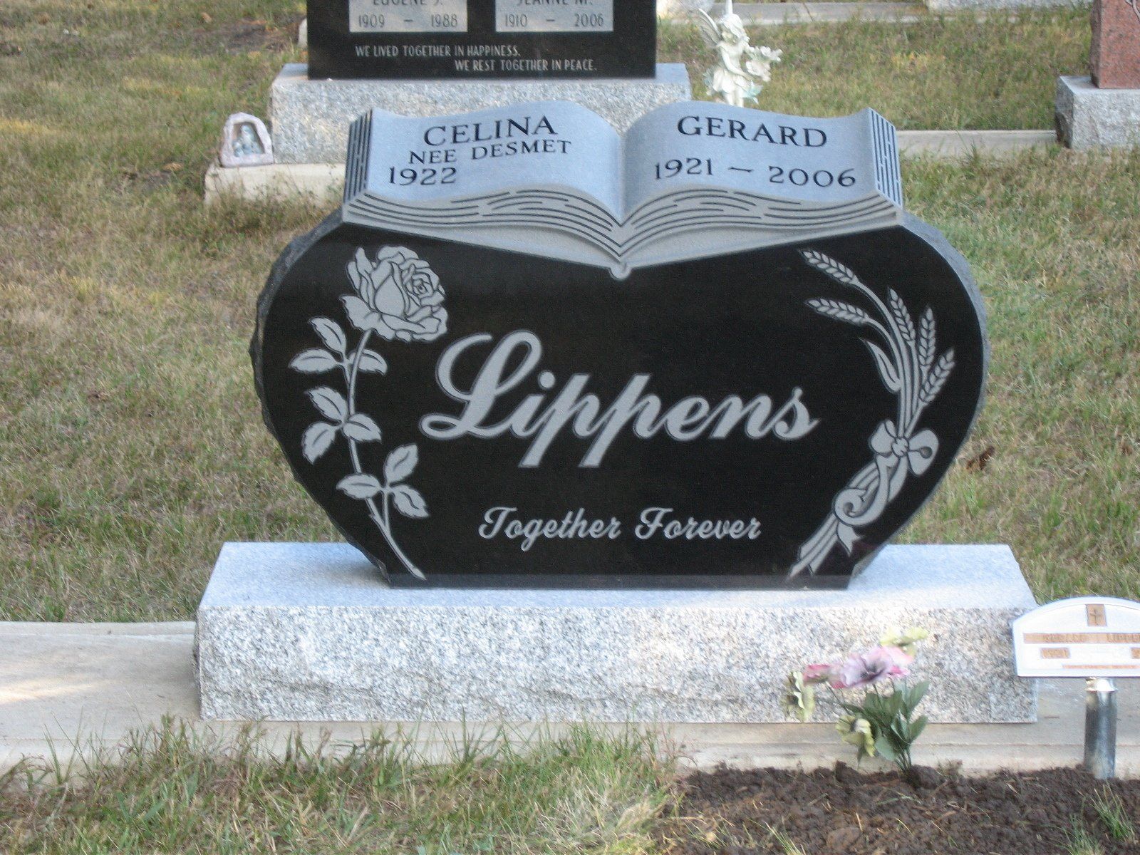 Black heart-shaped gravestone with 