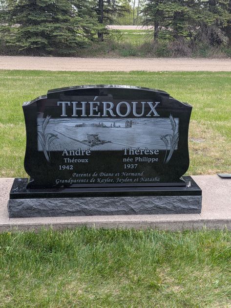 Black Cavers memorial headstone with two vases in a cemetery.