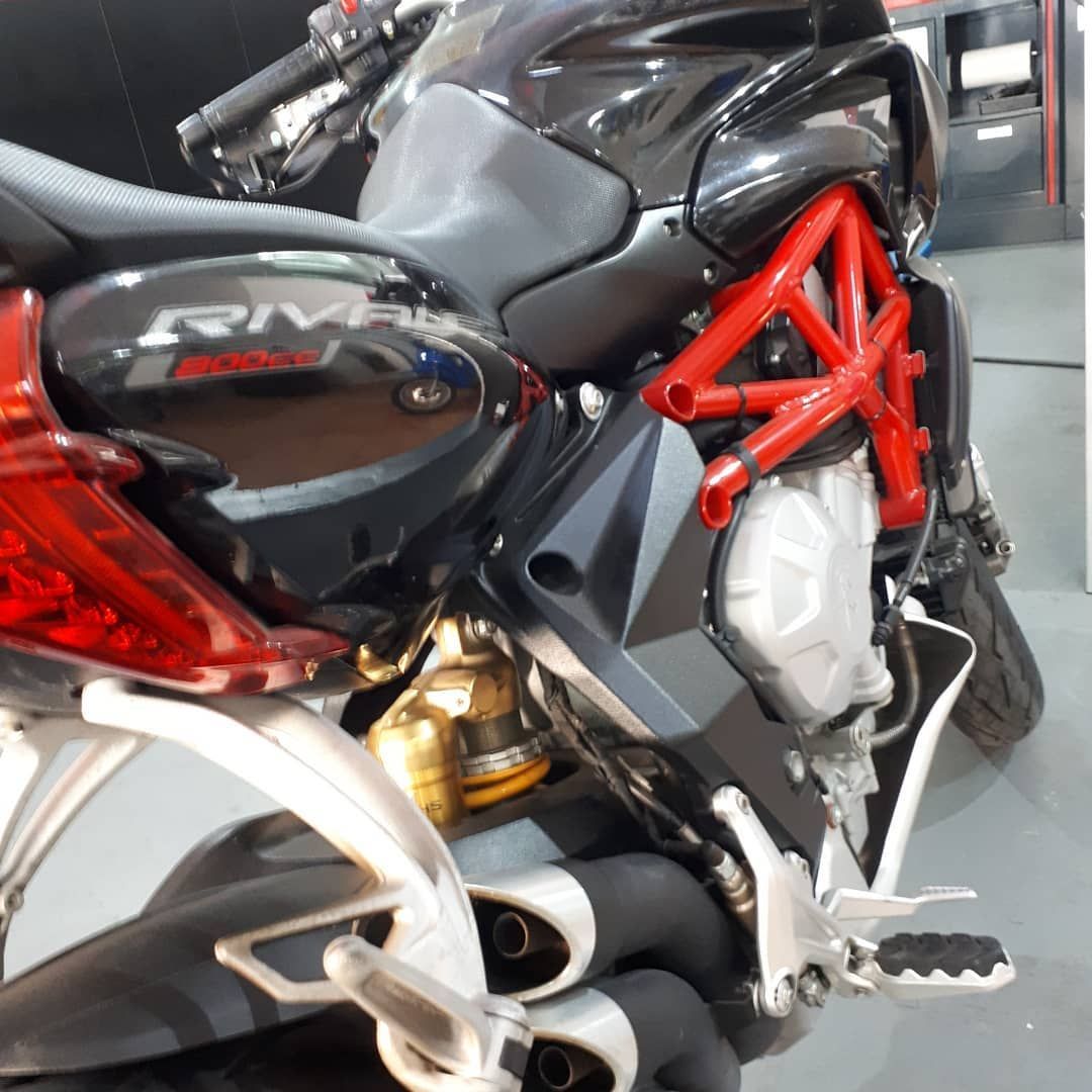 A black motorcycle with the word rival on the side