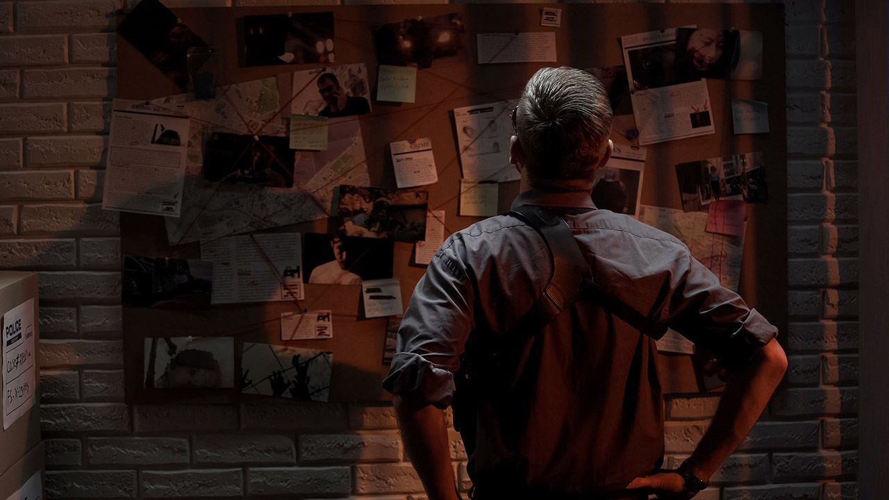 policeman analyzing information crime on investigation