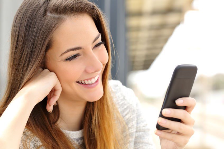 woman texting on smart phone