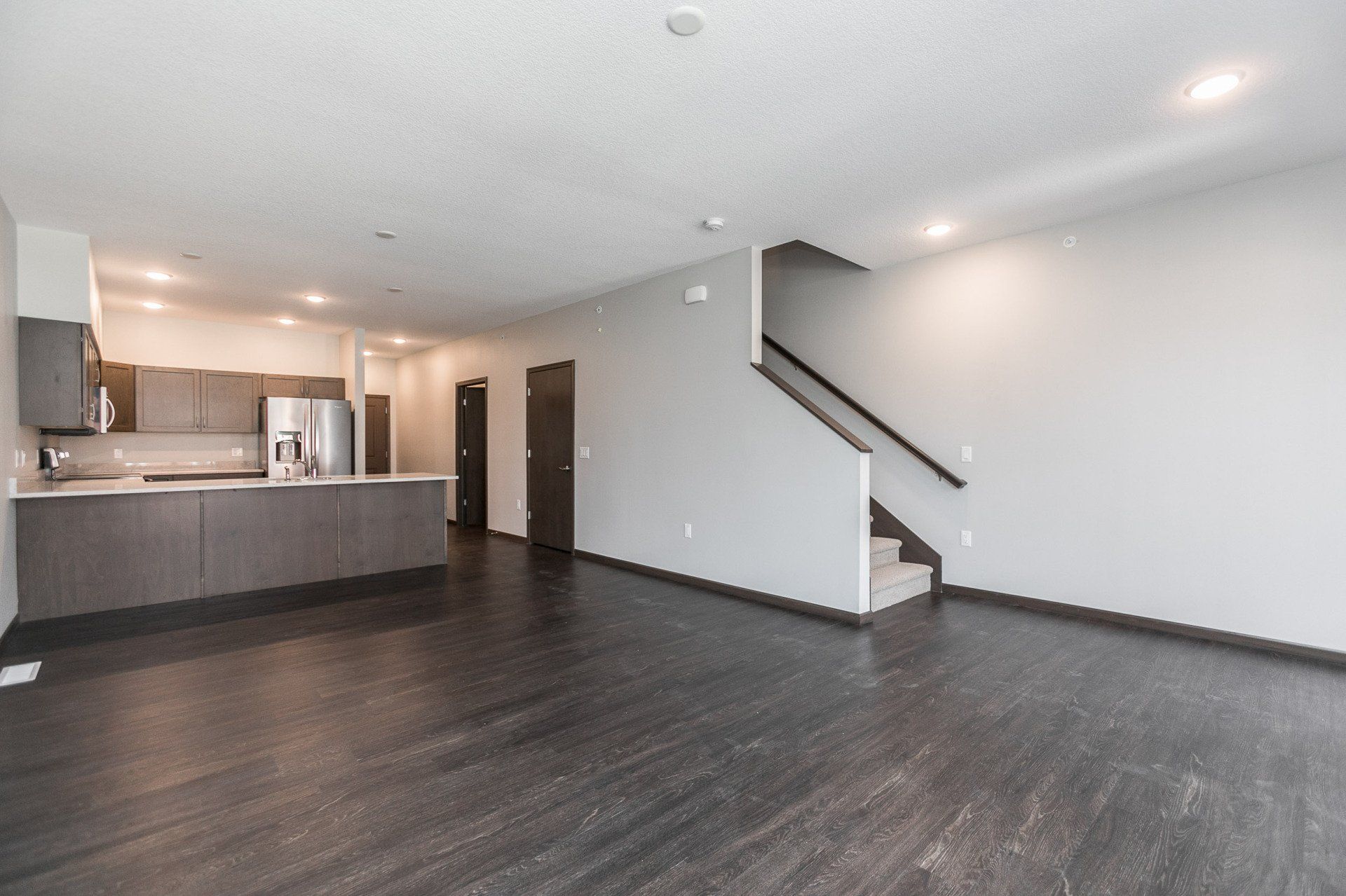 Interior of downstairs main living room with hardwood flooring