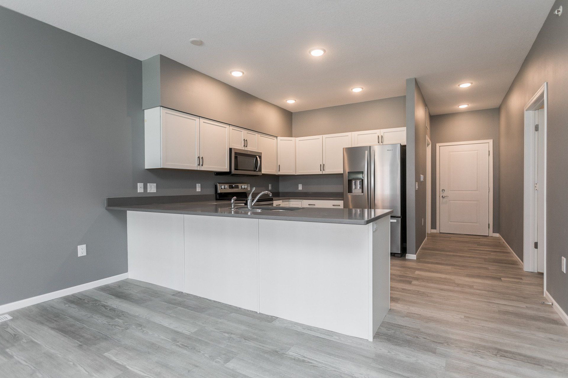 Interior of kitchen with white cabinetry