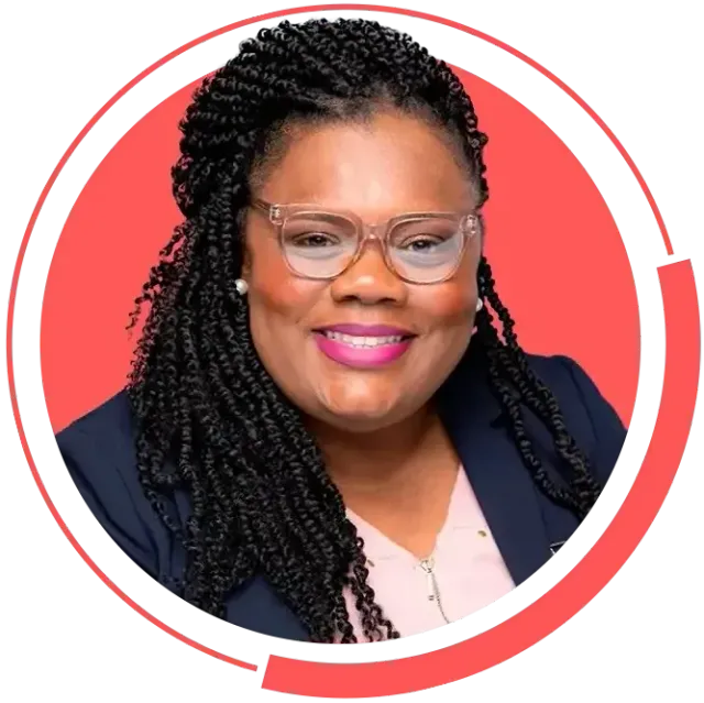 A woman with braids and glasses is smiling in a red circle