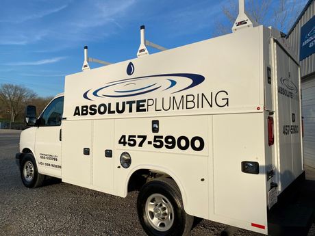 Plumber fixing a sink in bathroom — De Soto, IL — Absolute Plumbing Plumber fixing a sink in bathroom — De Soto, IL — Absolute Plumbing