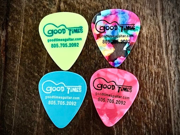 Four guitar picks with 