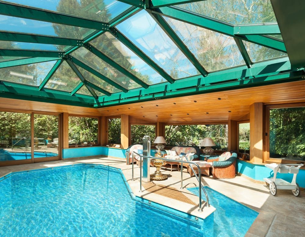 A Large Indoor Swimming Pool With A Green Roof — Renovo Contractors In Monash, ACT