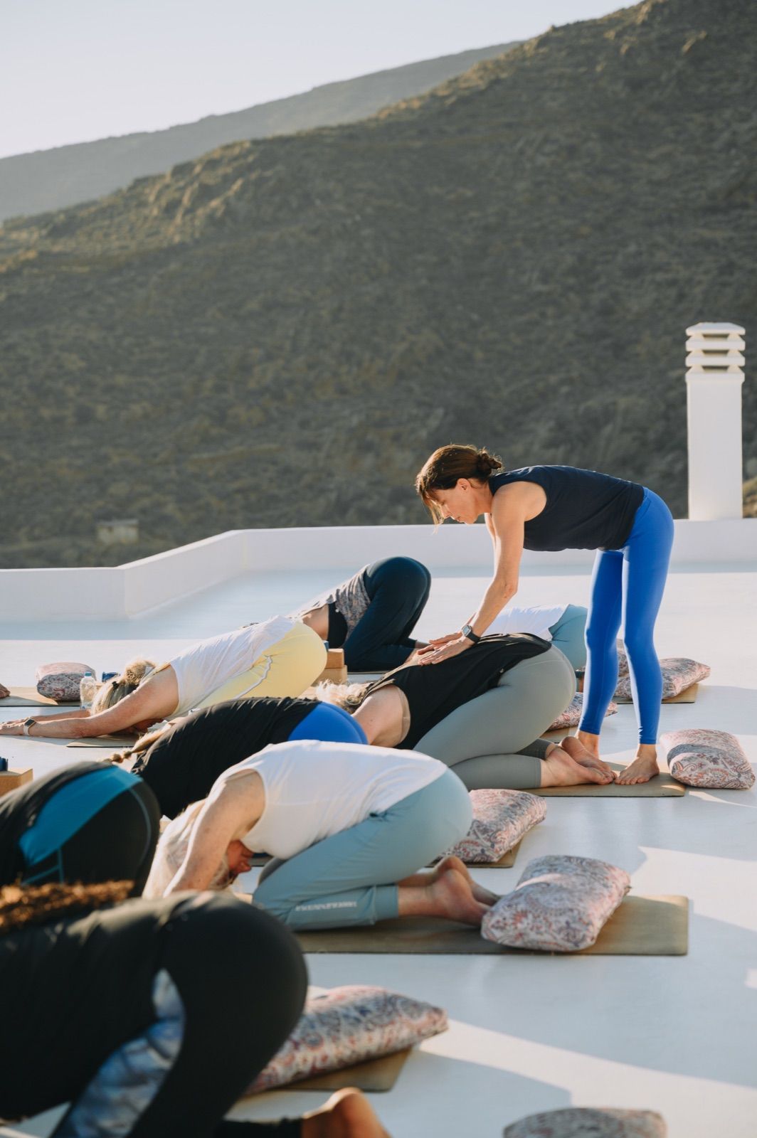 Meghan Jackson guiding students through a mat Pilates stretch