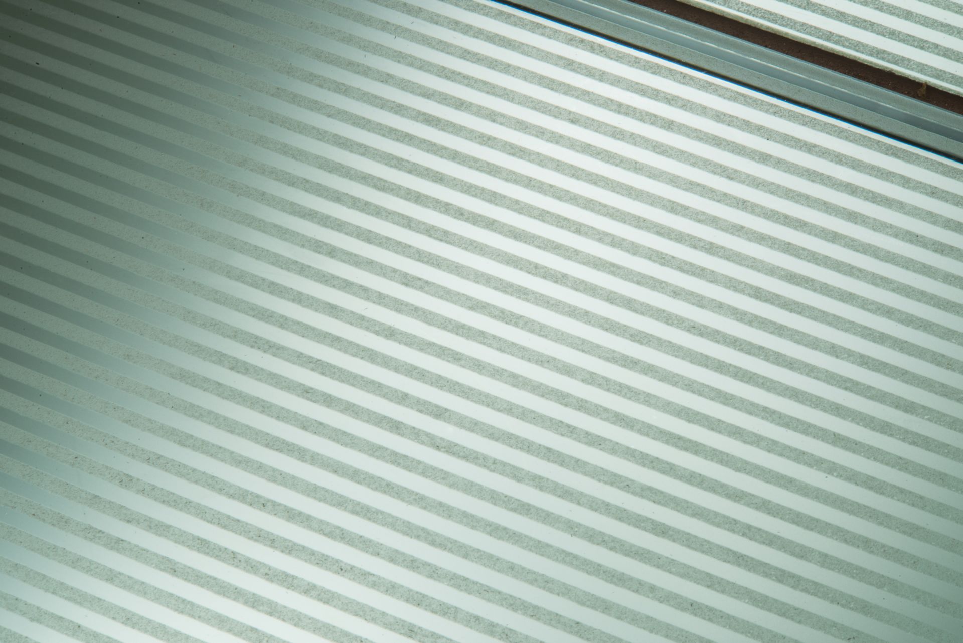 Diagonal green-gray striped texture close-up
