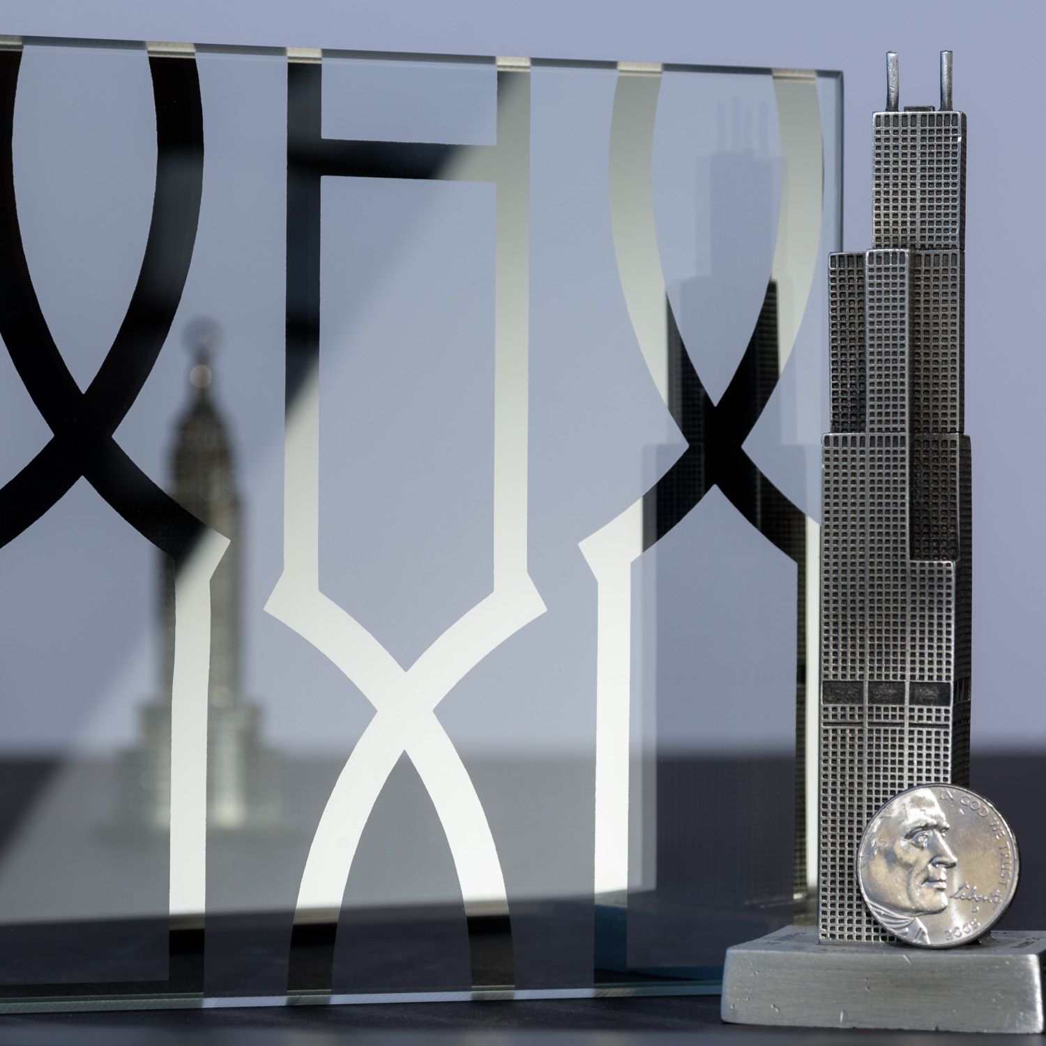 Chicago skyline architectural models with etched glass overlay and coin.