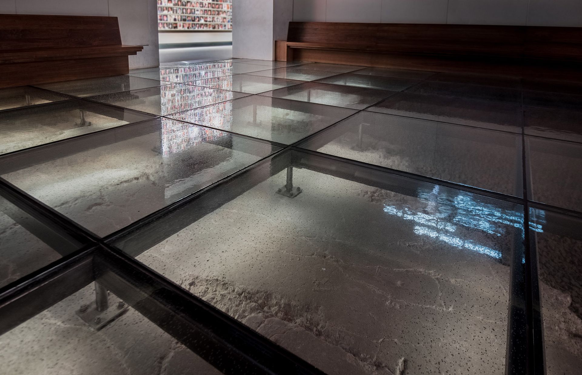 A museum room with a glass floor.