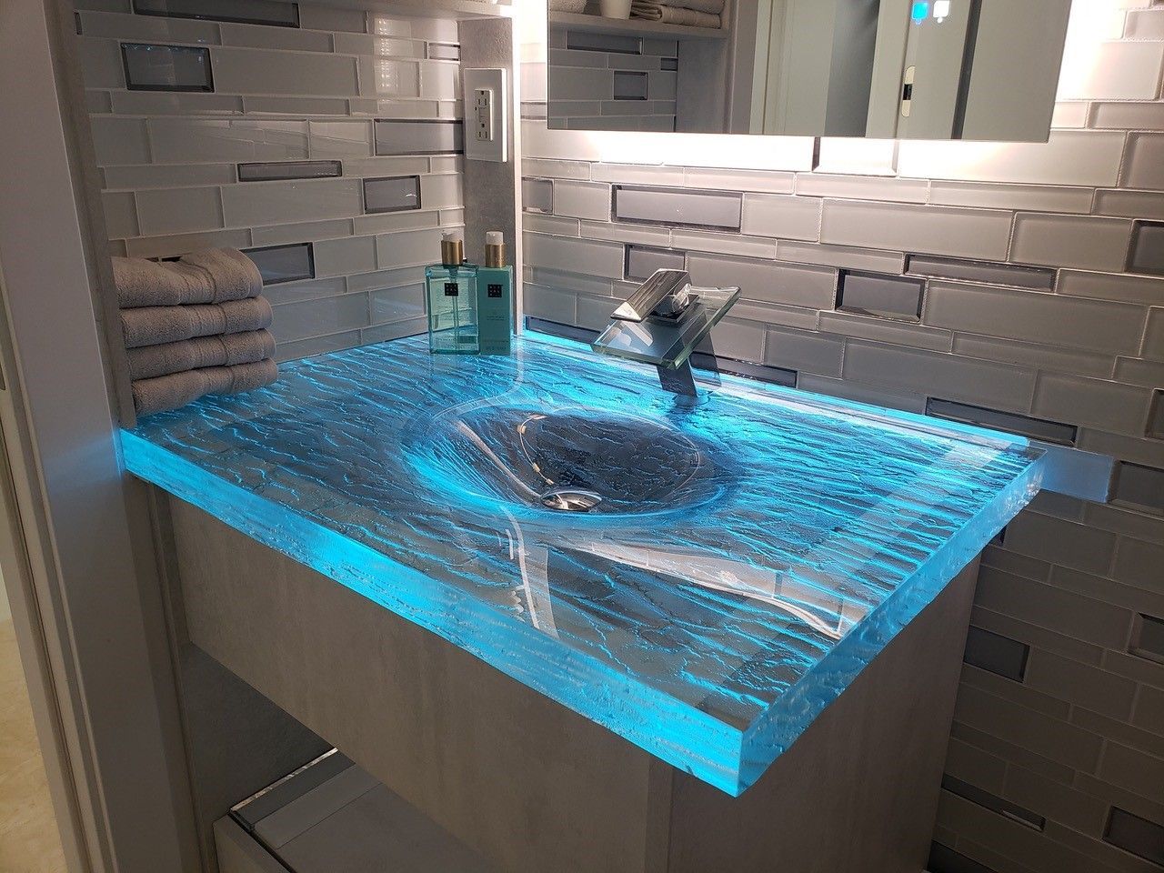 An LED backlit glass vanity An LED backlit glass vanity