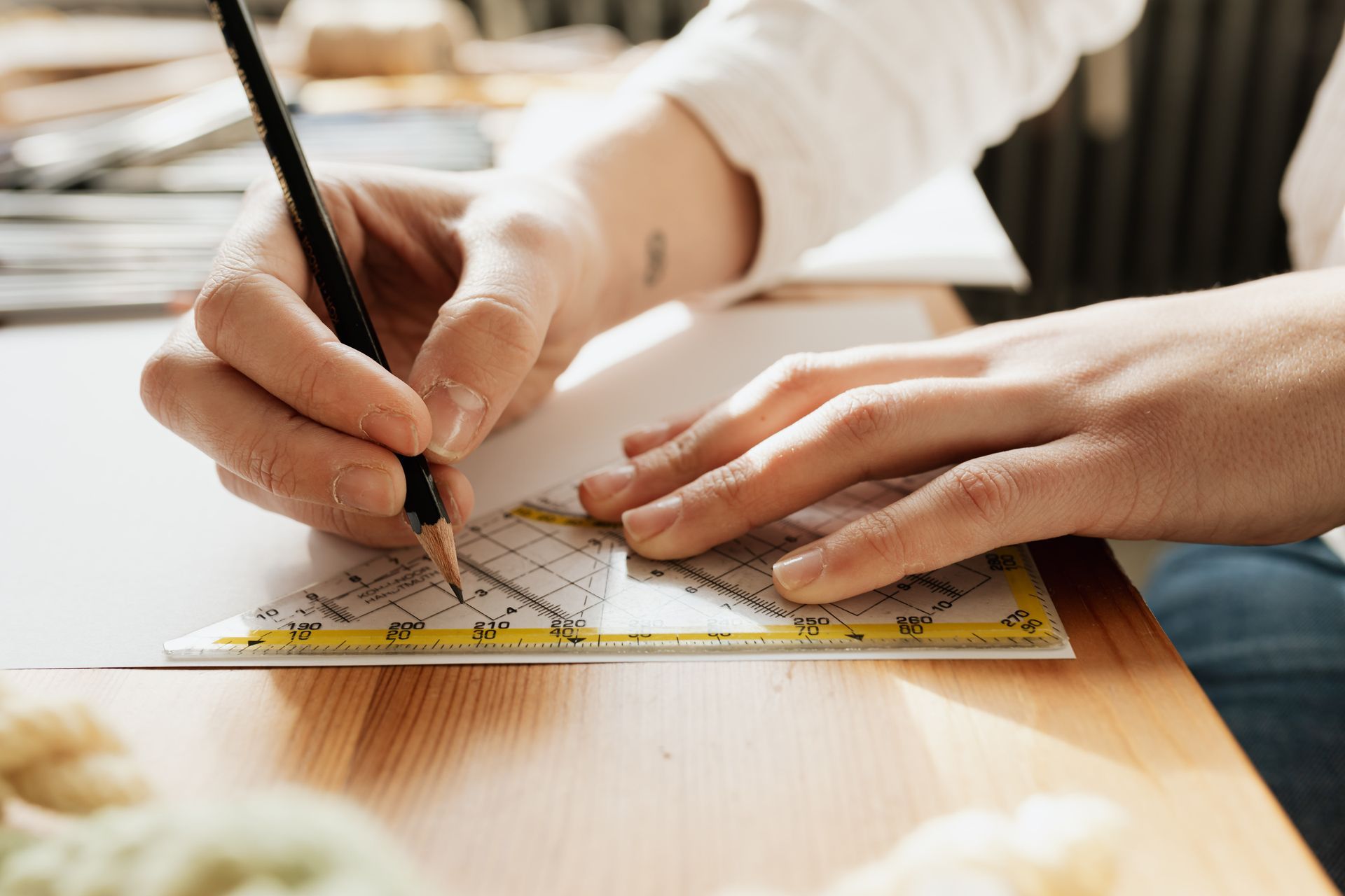 An engineer working on glass flooring calculations. An engineer working on glass flooring calculations.